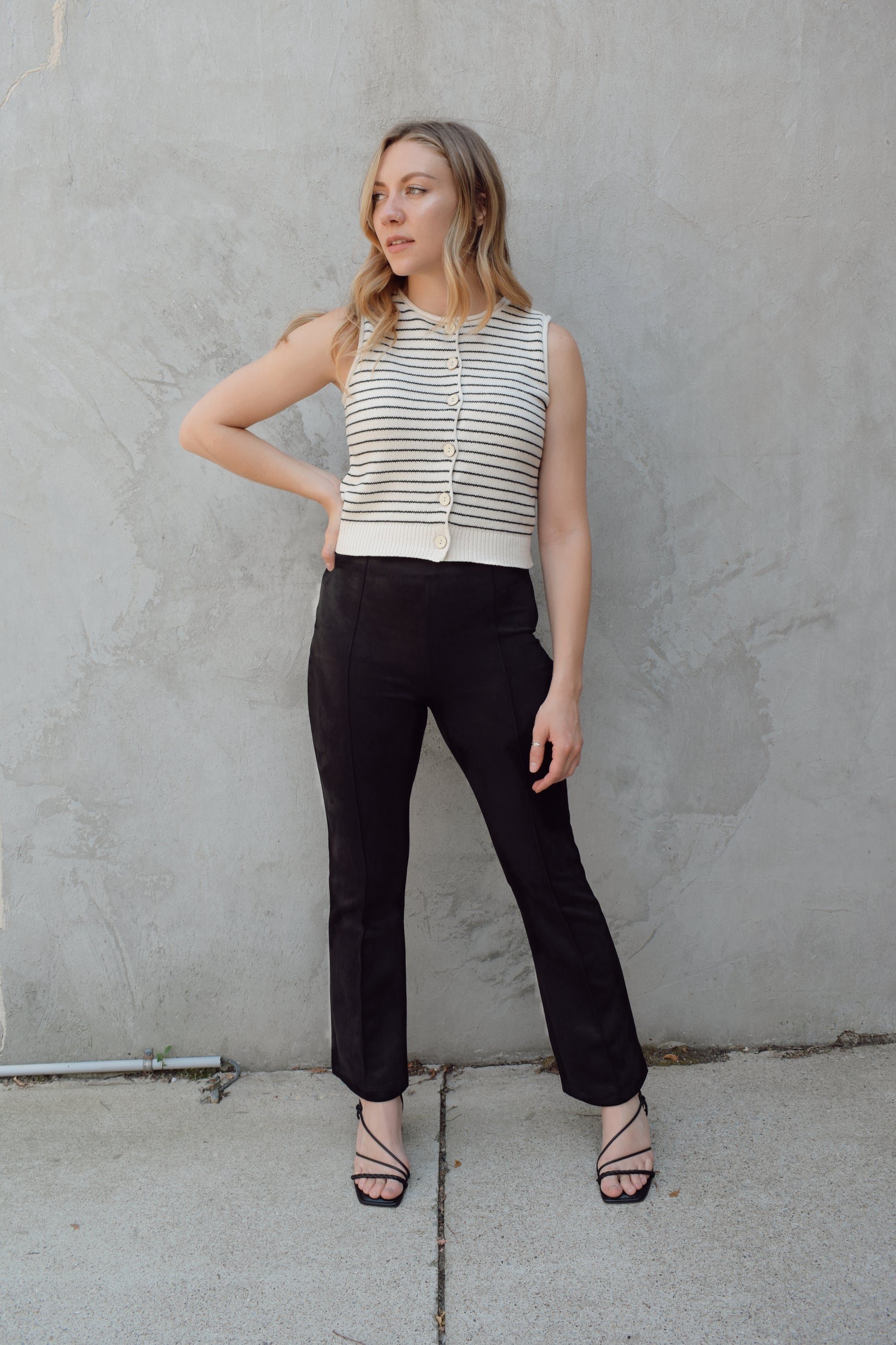 cropped striped sweater vest natural colored buttons down the front, crew neck, pin horizontal black stripes, solid ribbed hem