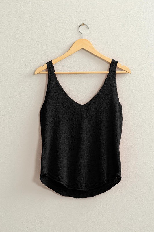 thin and lightweight sweater tank with v neck and rounded hem. full length. relaxed fit.