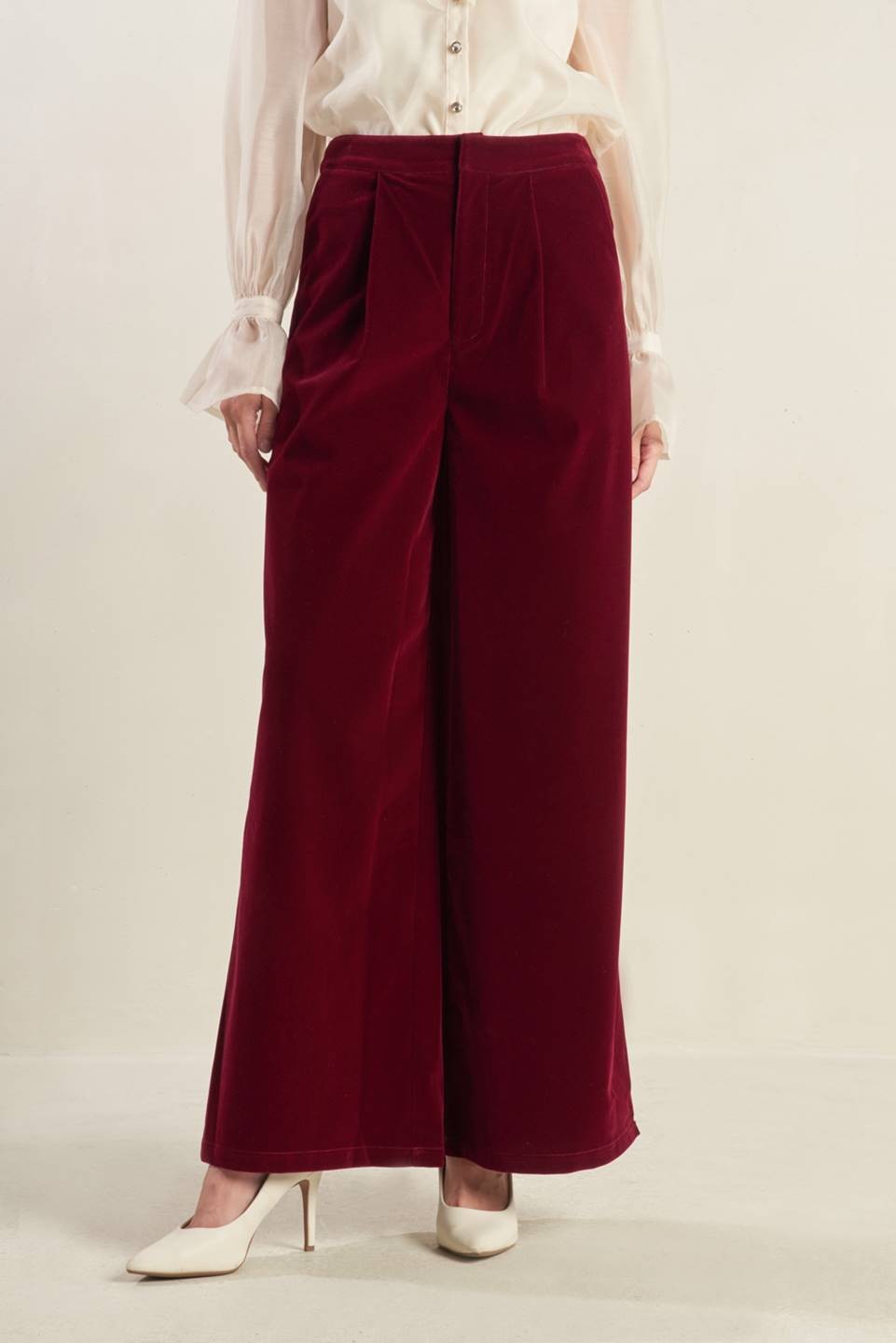 burgundy velvet trousers with zip and clasp enclosure has pockets and pleats