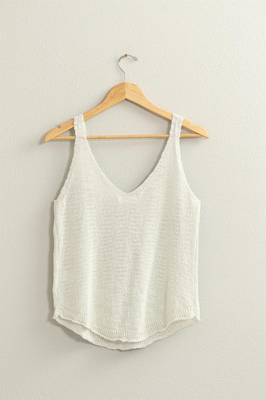 thin and lightweight sweater tank with v neck and rounded hem. full length. relaxed fit.