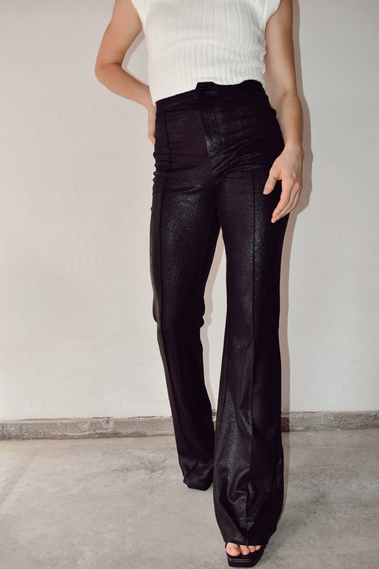 Black sparkly faux leather flares with pin tuck detail down the front zip and hook enclosure on front high waisted extra long