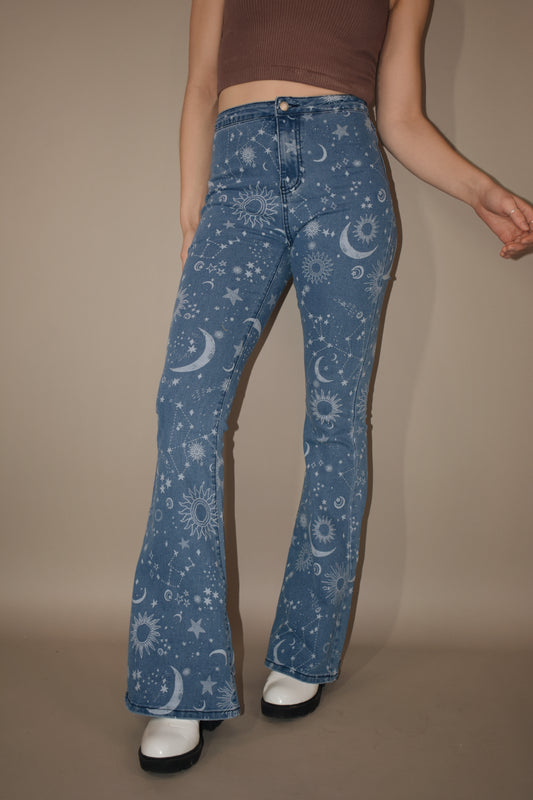 star and moon printed flare jeans. no front pockets or belt loops. high waisted. stretch denim.