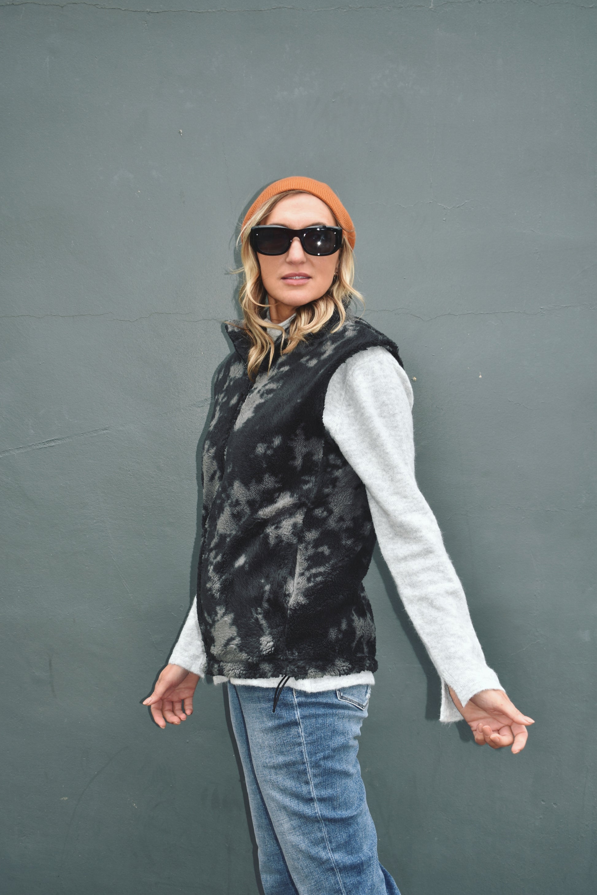 black and gray blot pattern sherpa vest full length high collar oversized fit adjustable bungee at the hem