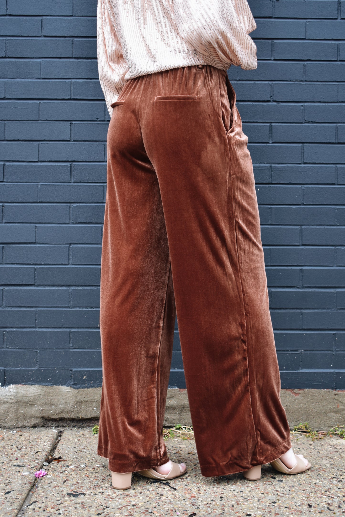 dark copper velvet trousers with front pleats by pockets, front zip and clasp enclosure, pockets, fake back pockets, wide leg, beltloops.