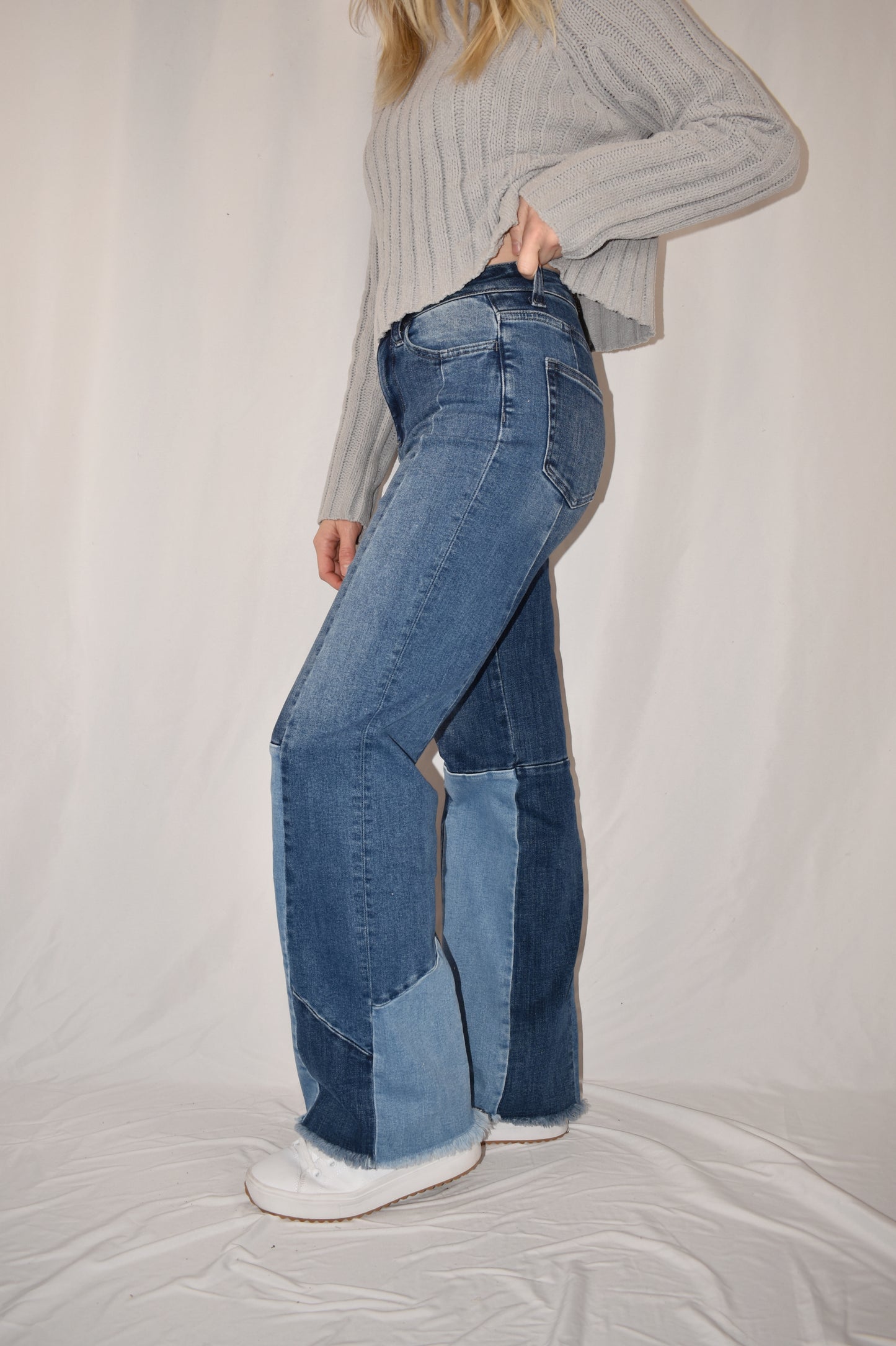 boyfriend/straight leg style jeans with stretch denim. Patchwork style ranging from medium to light wash. frayed hem, full length.