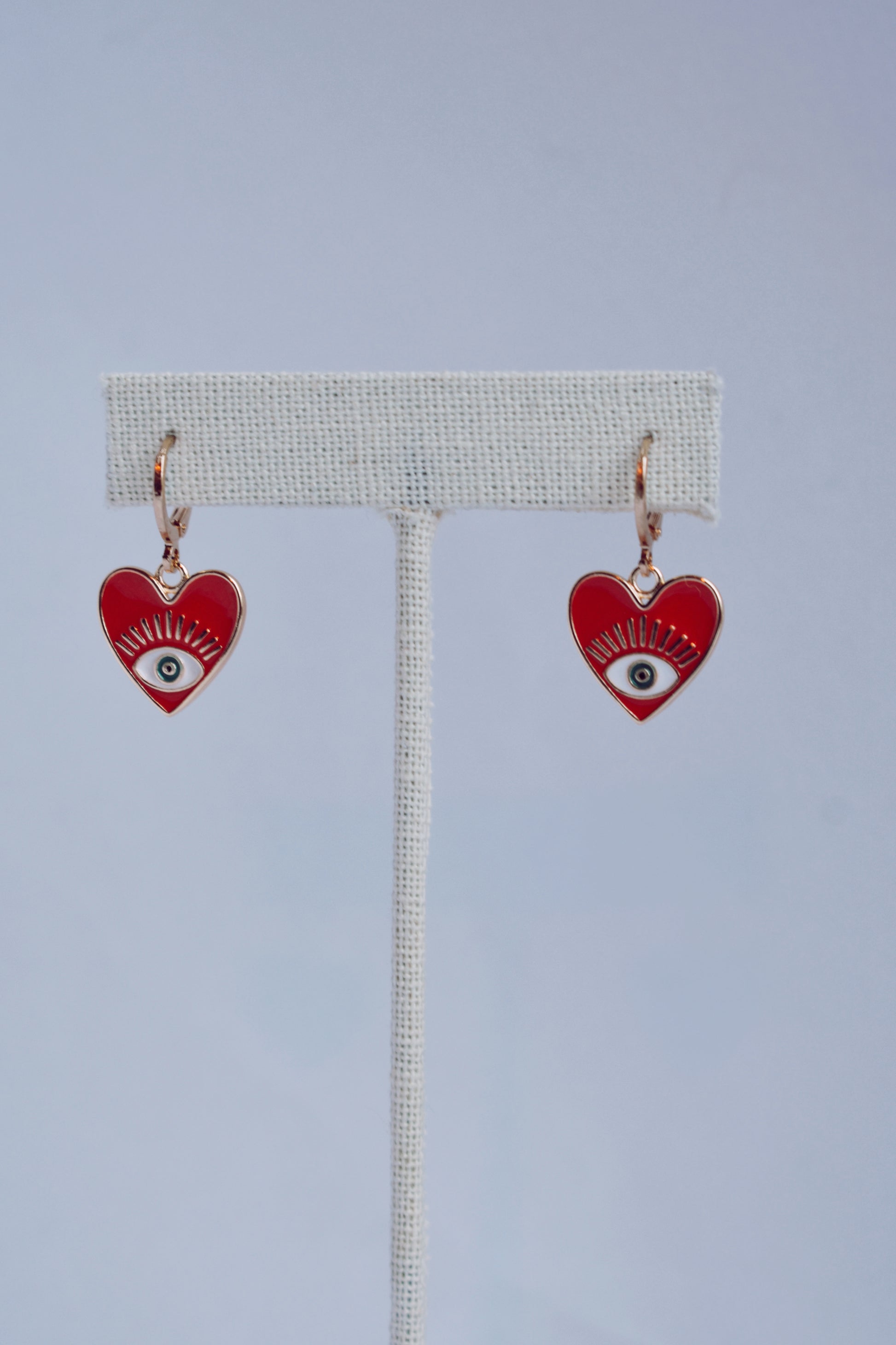 gold plated and red enamel evil eye heart dainty huggie style earrings