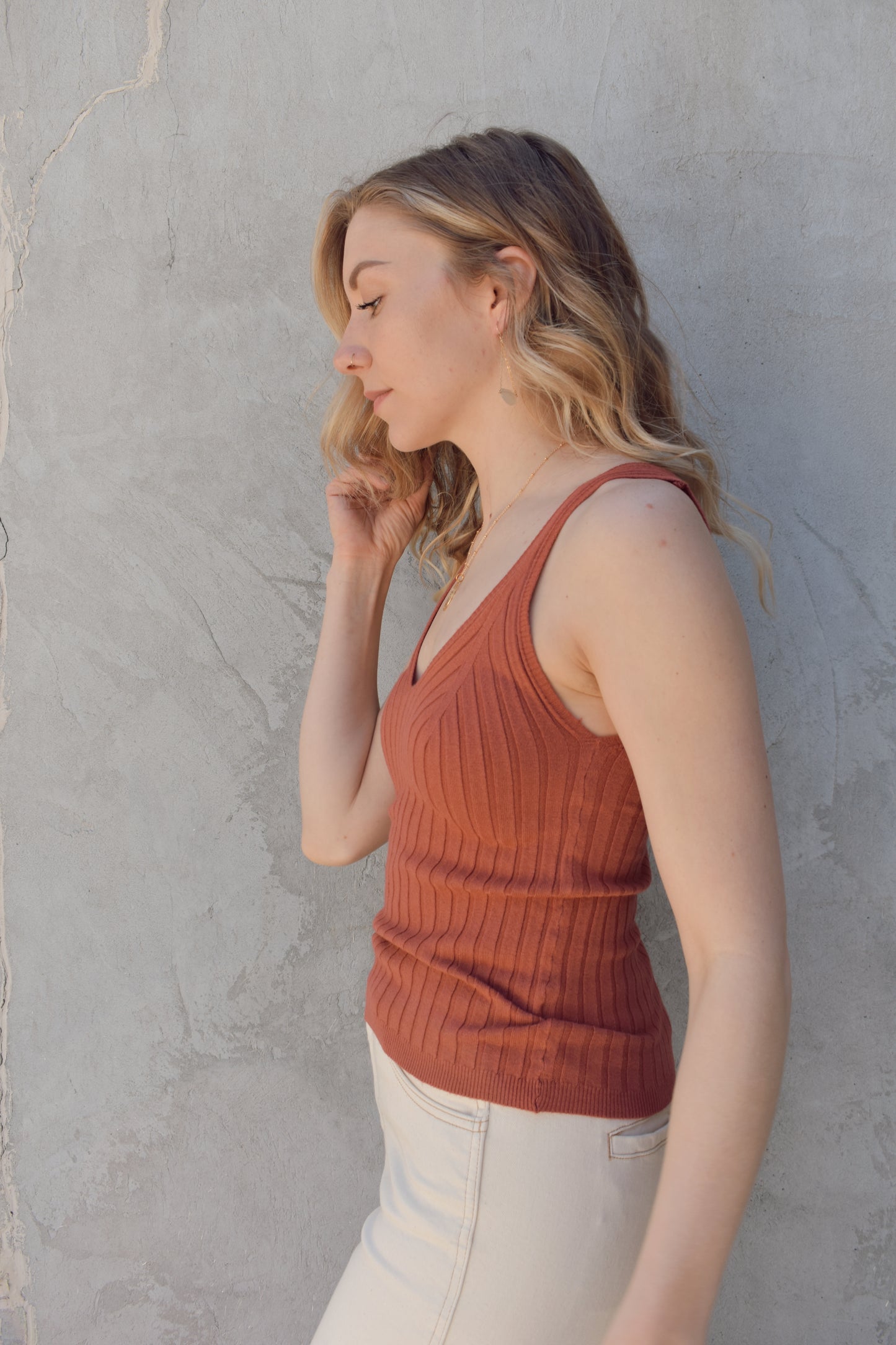 v neck sweater tank with wide ribbed texture. lightweight. stretchy. full length. fitted.