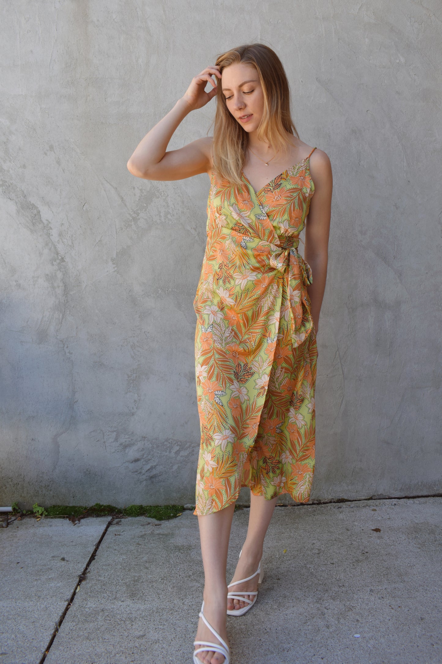 satin spaghetti strap (adjustable) midi wrap dress with light green background and floral/ botanical print in peach, rust, ivory. wedding guest attire.