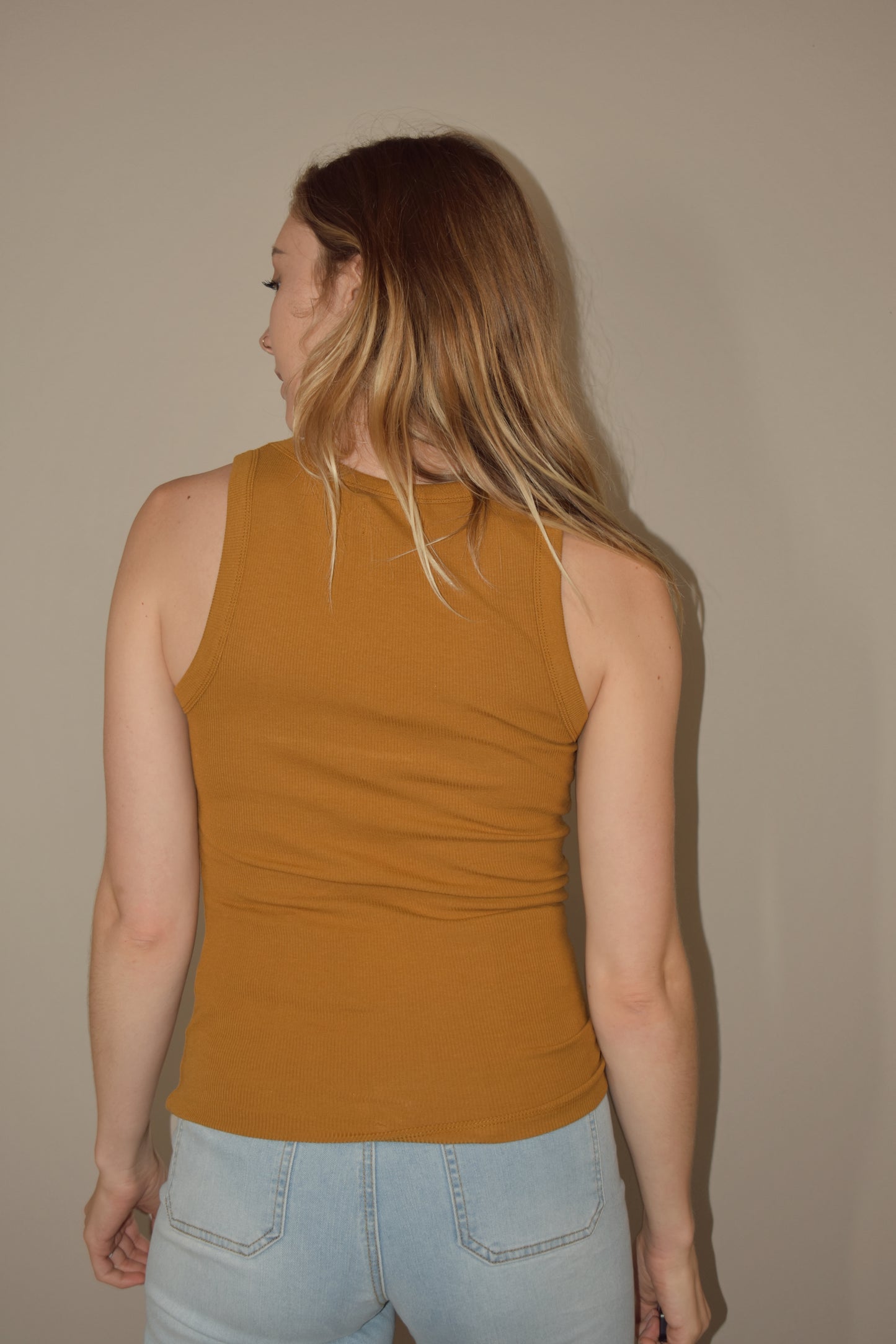 full length fitted tank with crew neck. stretchy and soft yet durable material. 