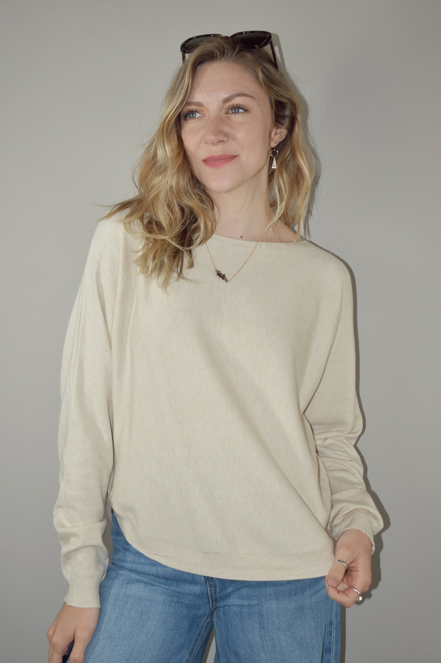 boat neck style pullover sweater with scooped hem and super soft fabric