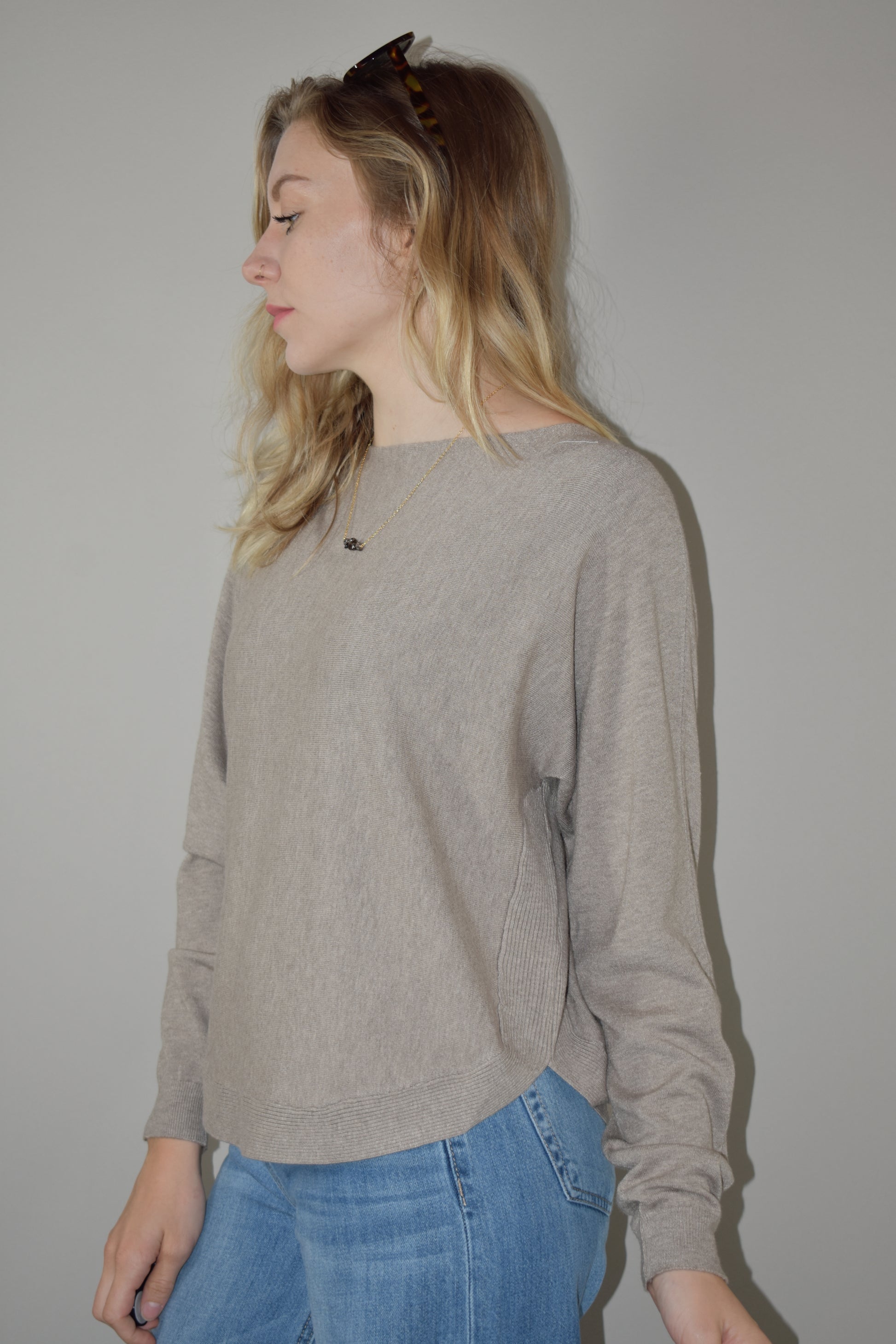 boat neck style pullover sweater with scooped hem and super soft fabric