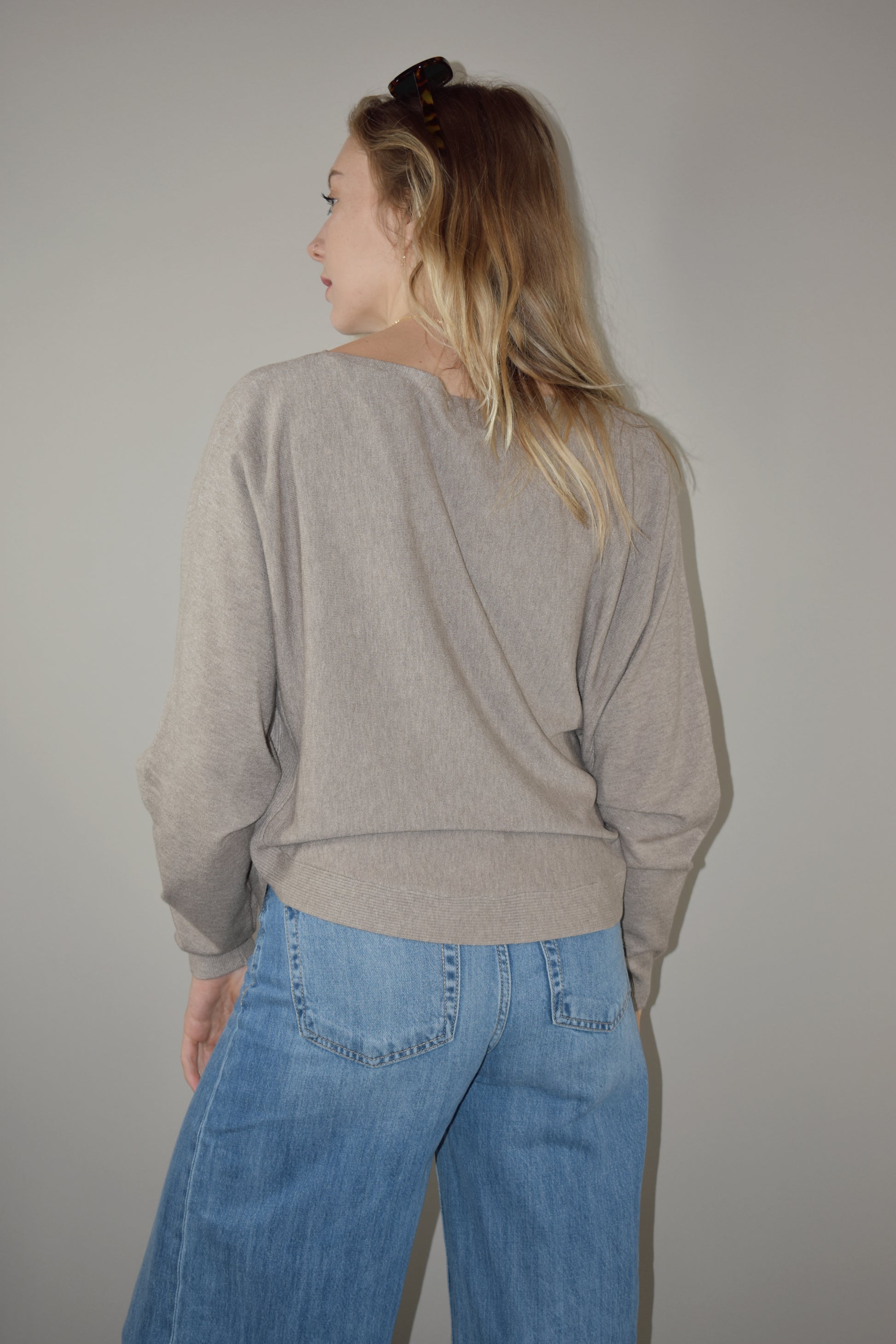 boat neck style pullover sweater with scooped hem and super soft fabric