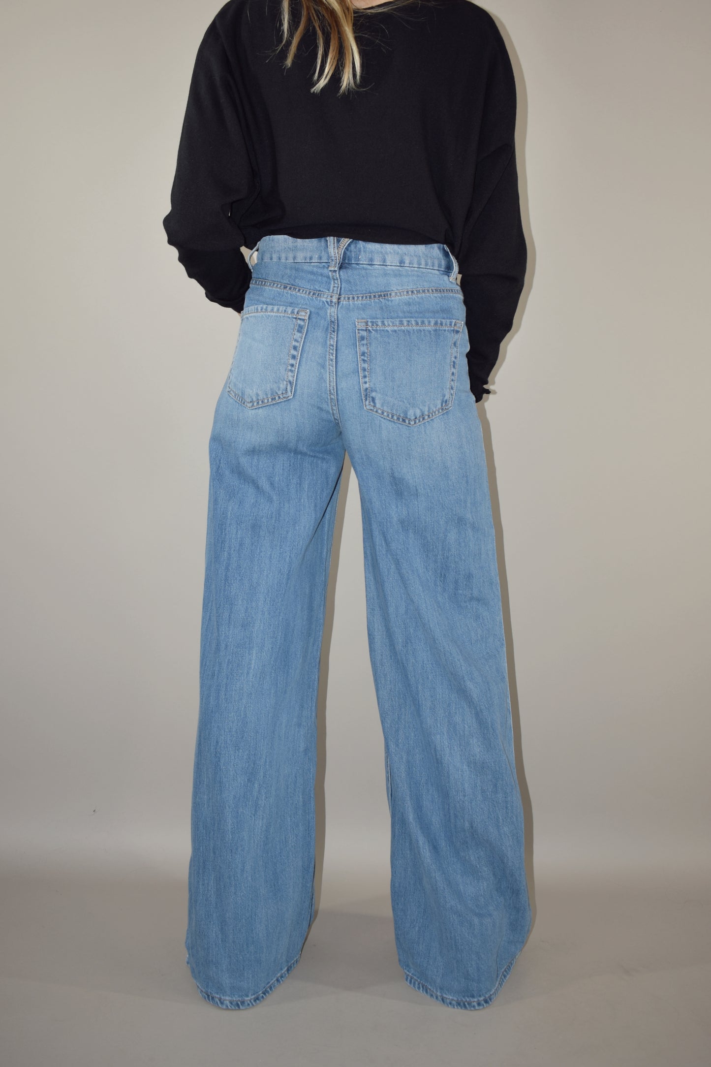 ultra wide high waisted light wash jeans no distressing or holes full length slightly long  