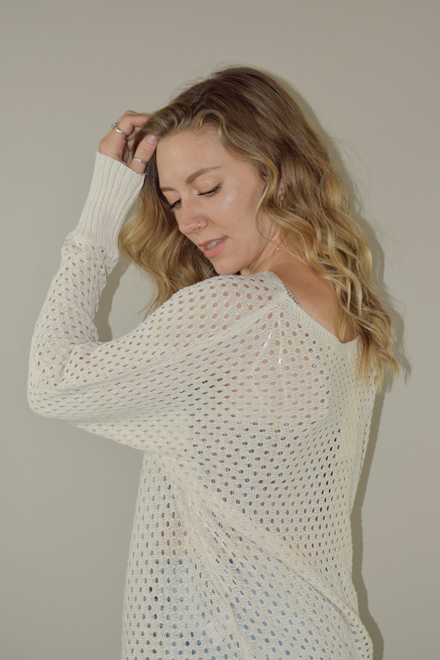 full length long sleeve eyelet lightweight knit sweater with ribbed cuffs and a scoop neck. slouchy style 