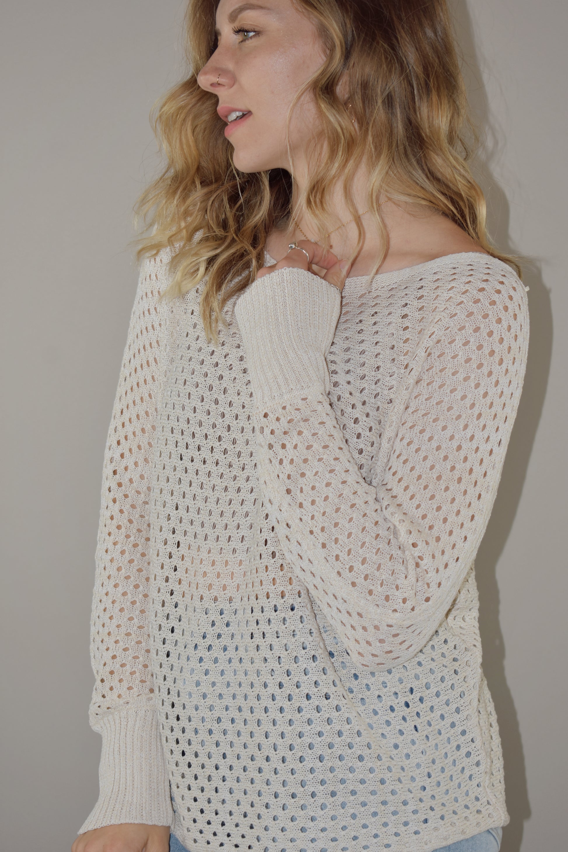 full length long sleeve eyelet lightweight knit sweater with ribbed cuffs and a scoop neck. slouchy style 