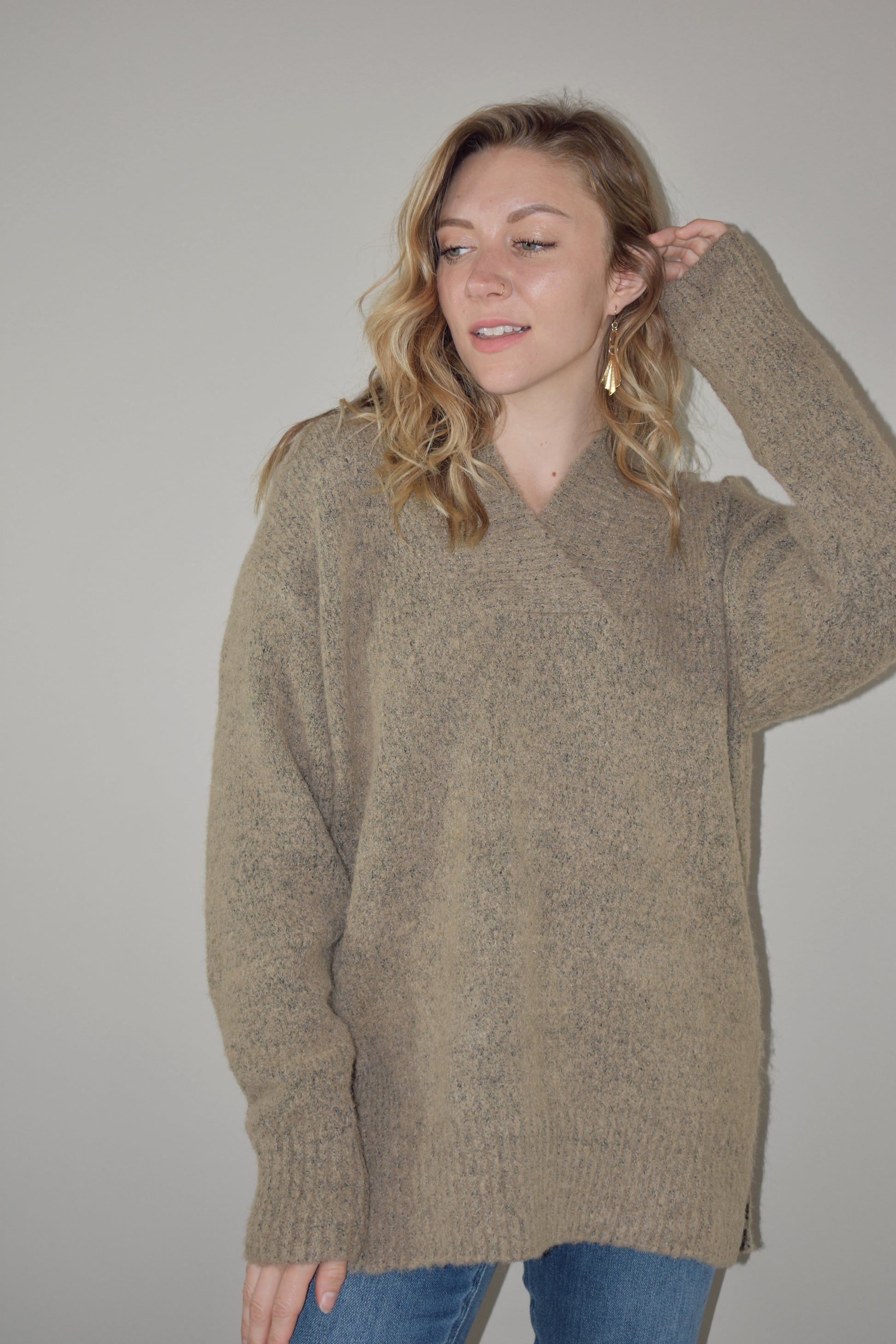 oversized sweater with v criss cross neck with ribbed detailing on neckline, hem and cuffs. two tone knit. side slits on hem