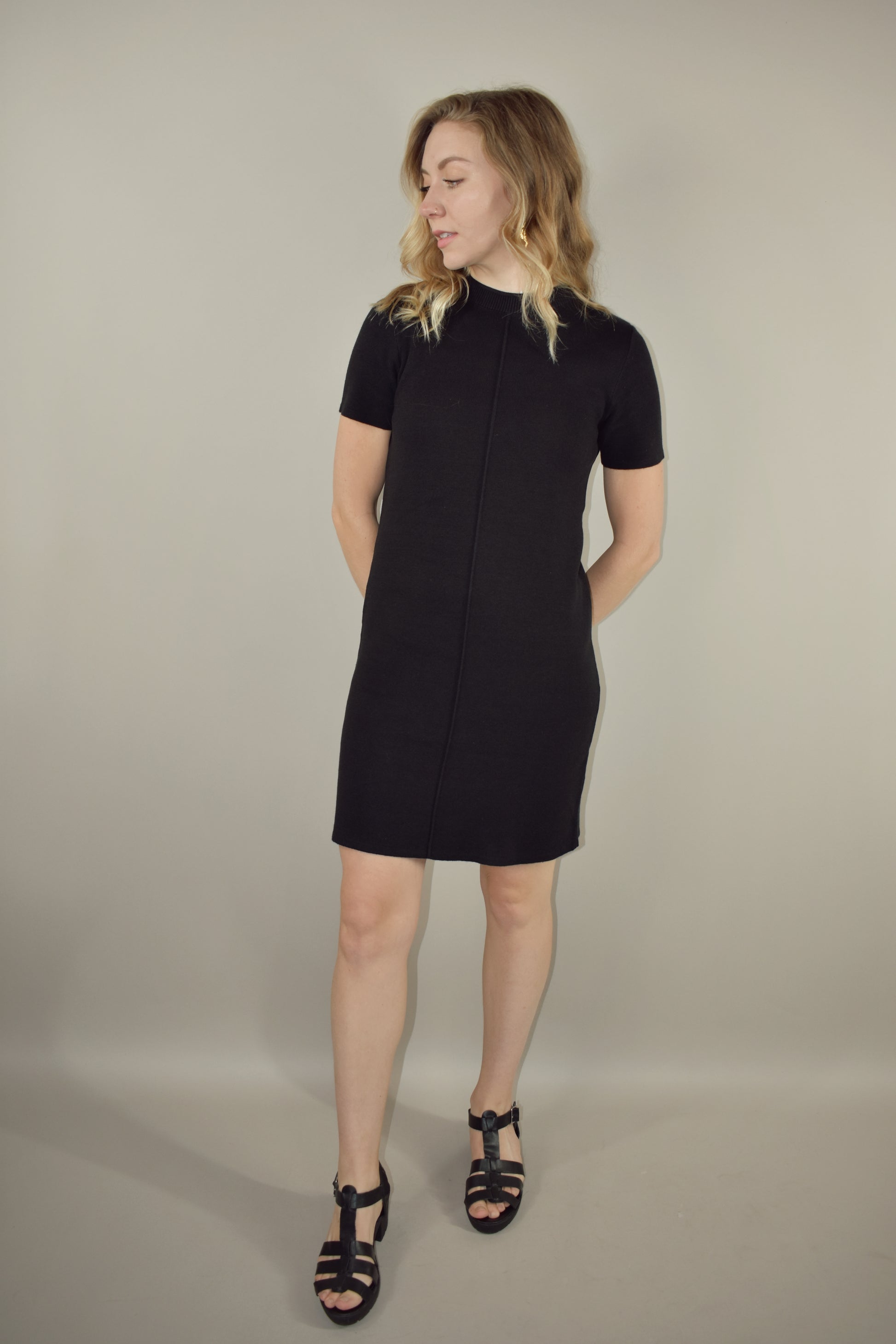 semi mock neck tee sweater dress with exposed seam detail down the front length hits above the knee