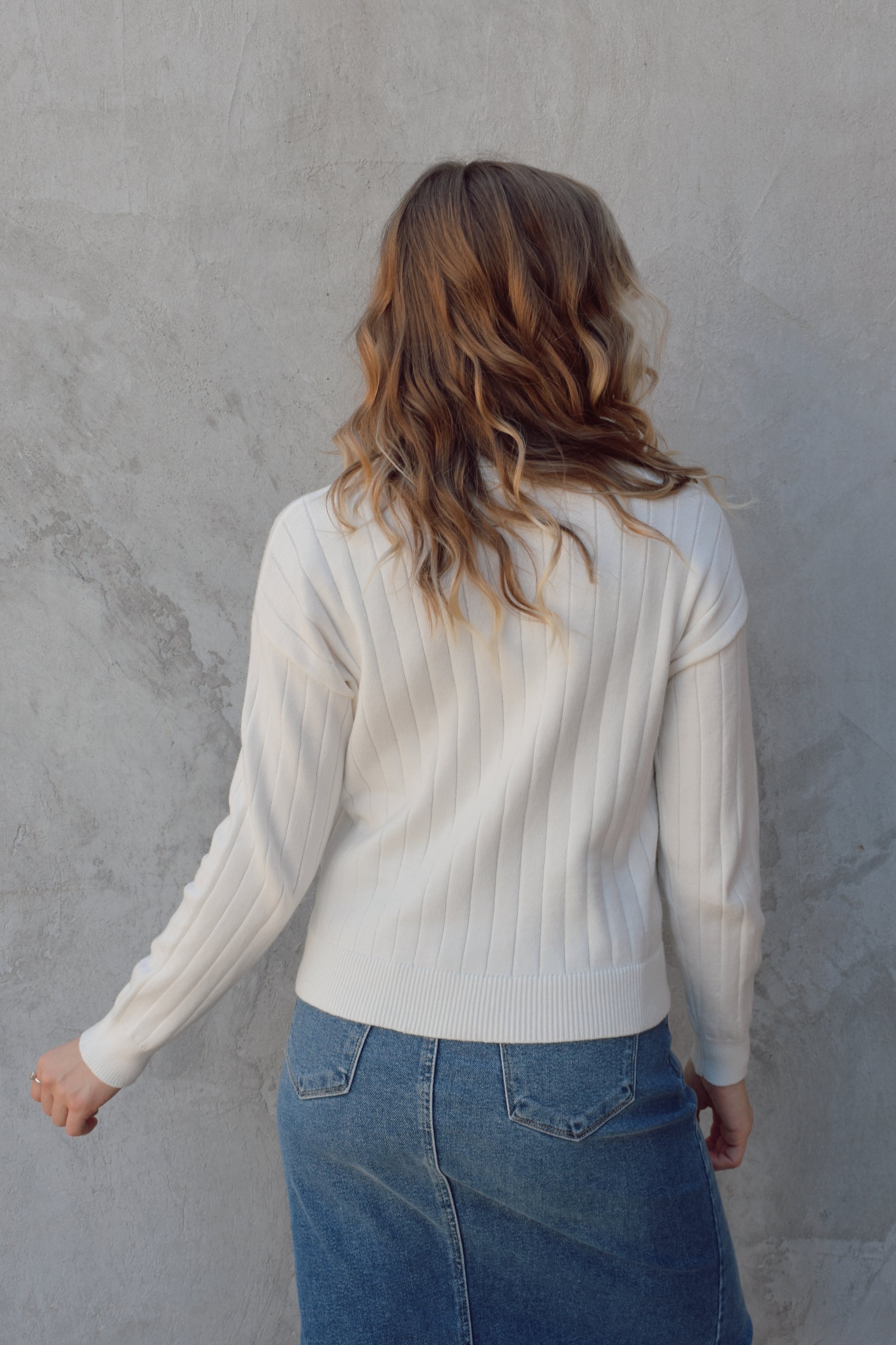 lightweight ribbed crewneck sweater. ribs are vertical, full length, drop shoulders.