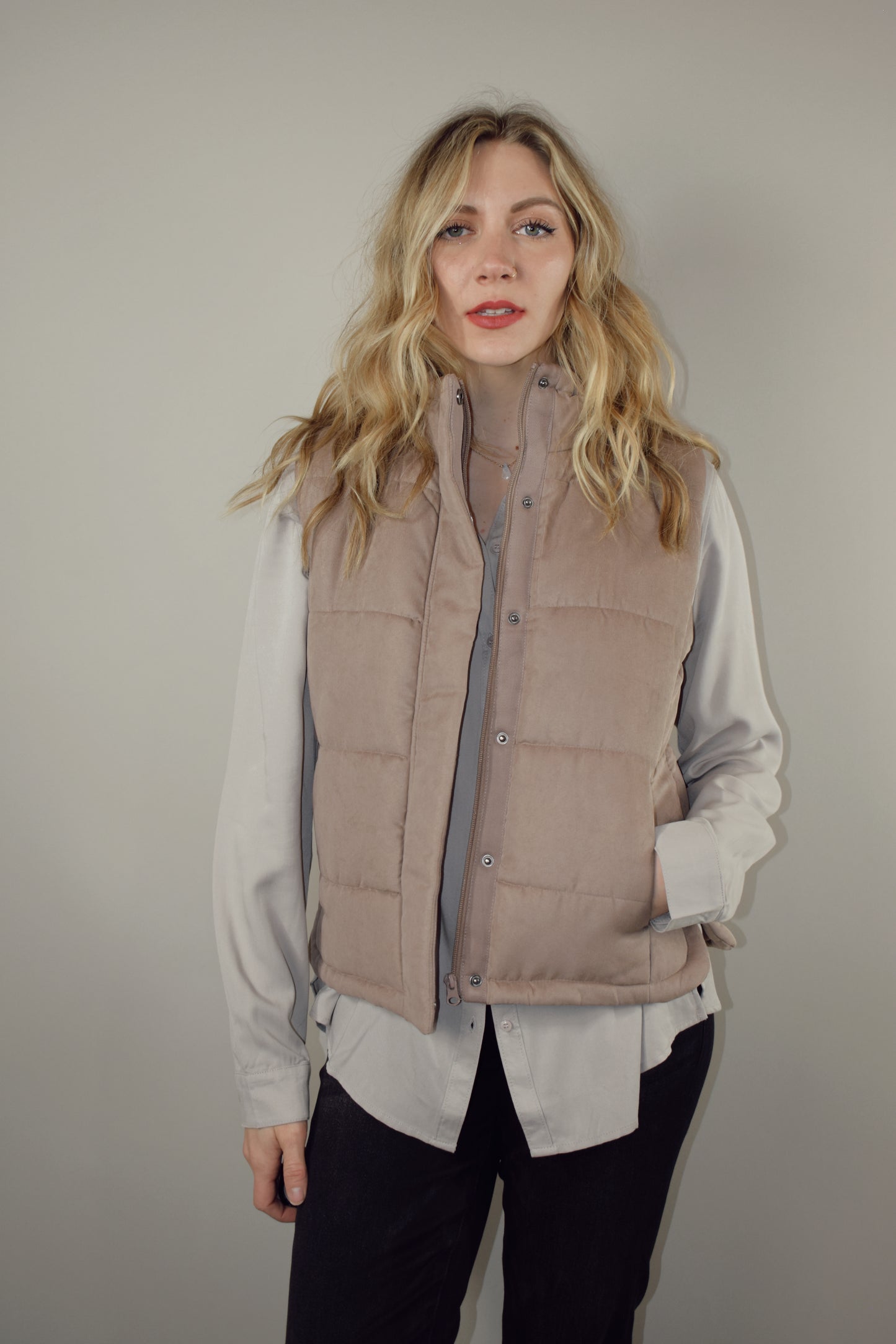 super soft suede like fabric full length puffer vest with collar zip and snap front enclosure has pockets 