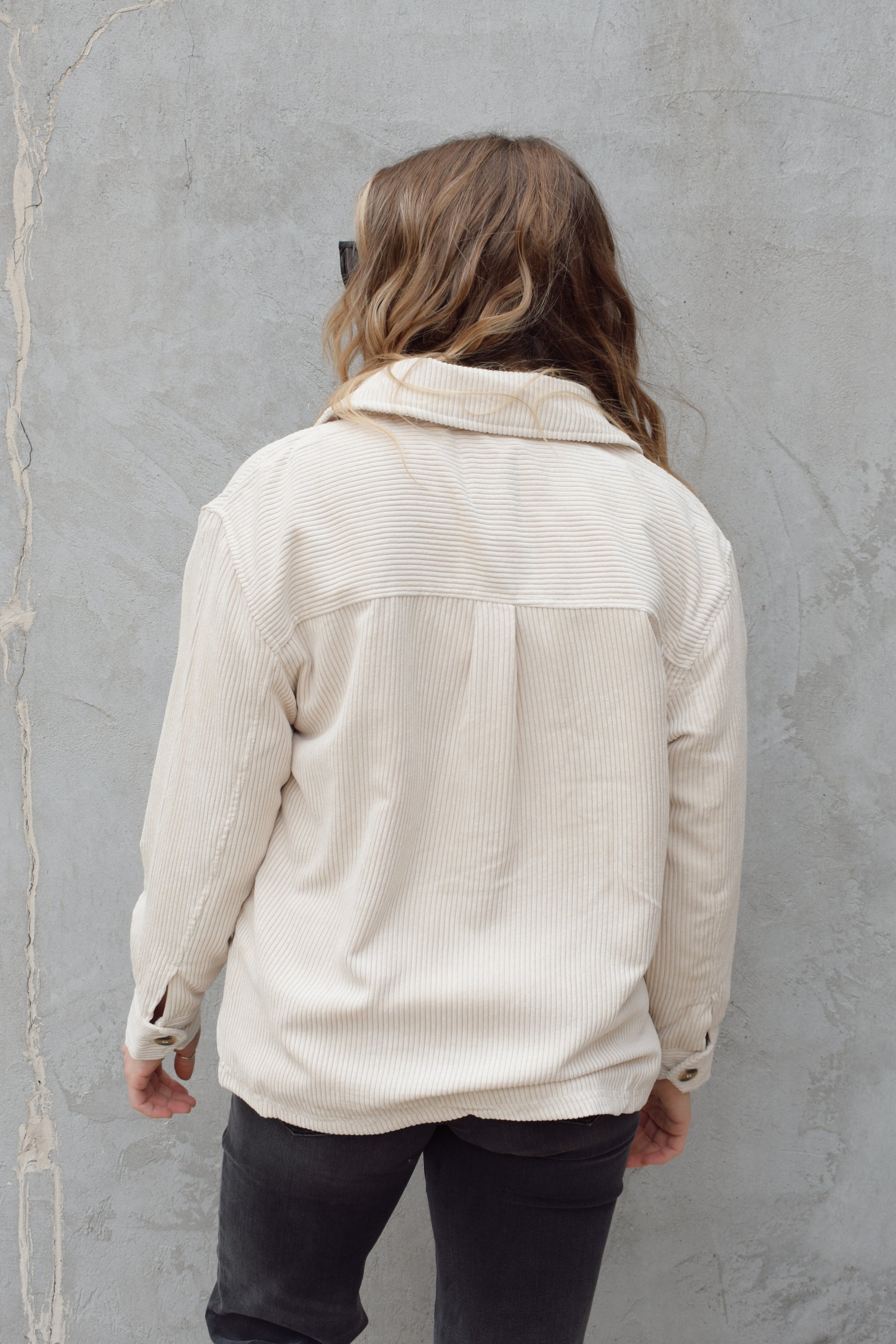 corduroy button down shacket, fur lined, has side pockets, patch breast pockets with fold and button enclosure, full length