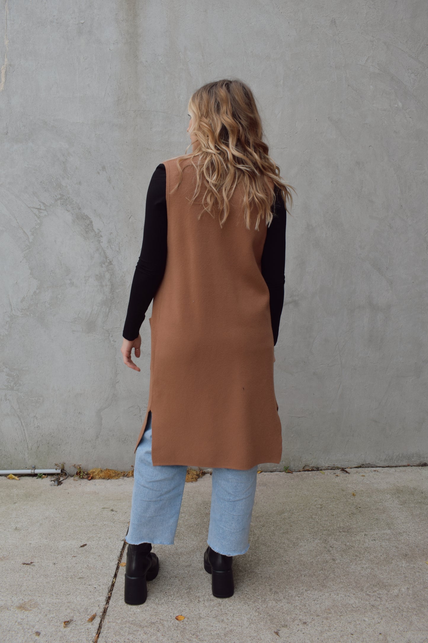 longline cardigan vest with shall collar and front patch pockets. side slits