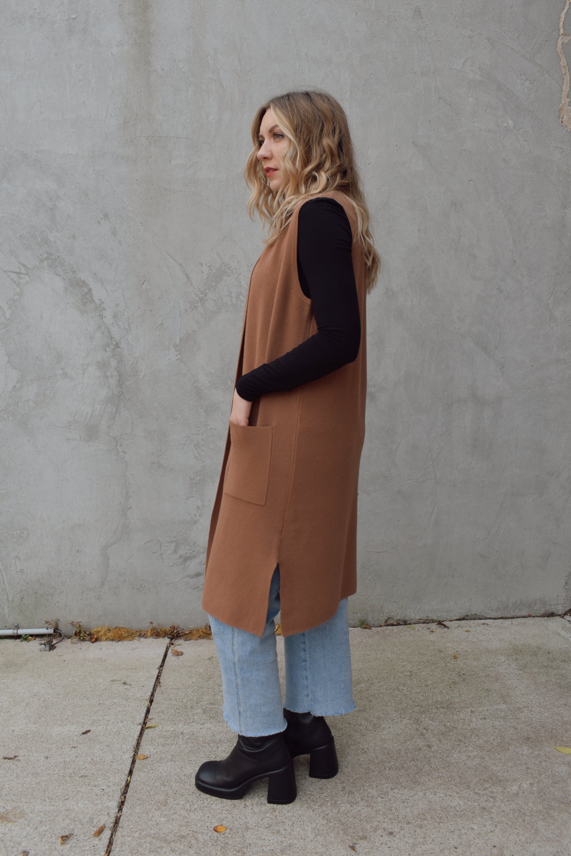 longline cardigan vest with shall collar and front patch pockets. side slits