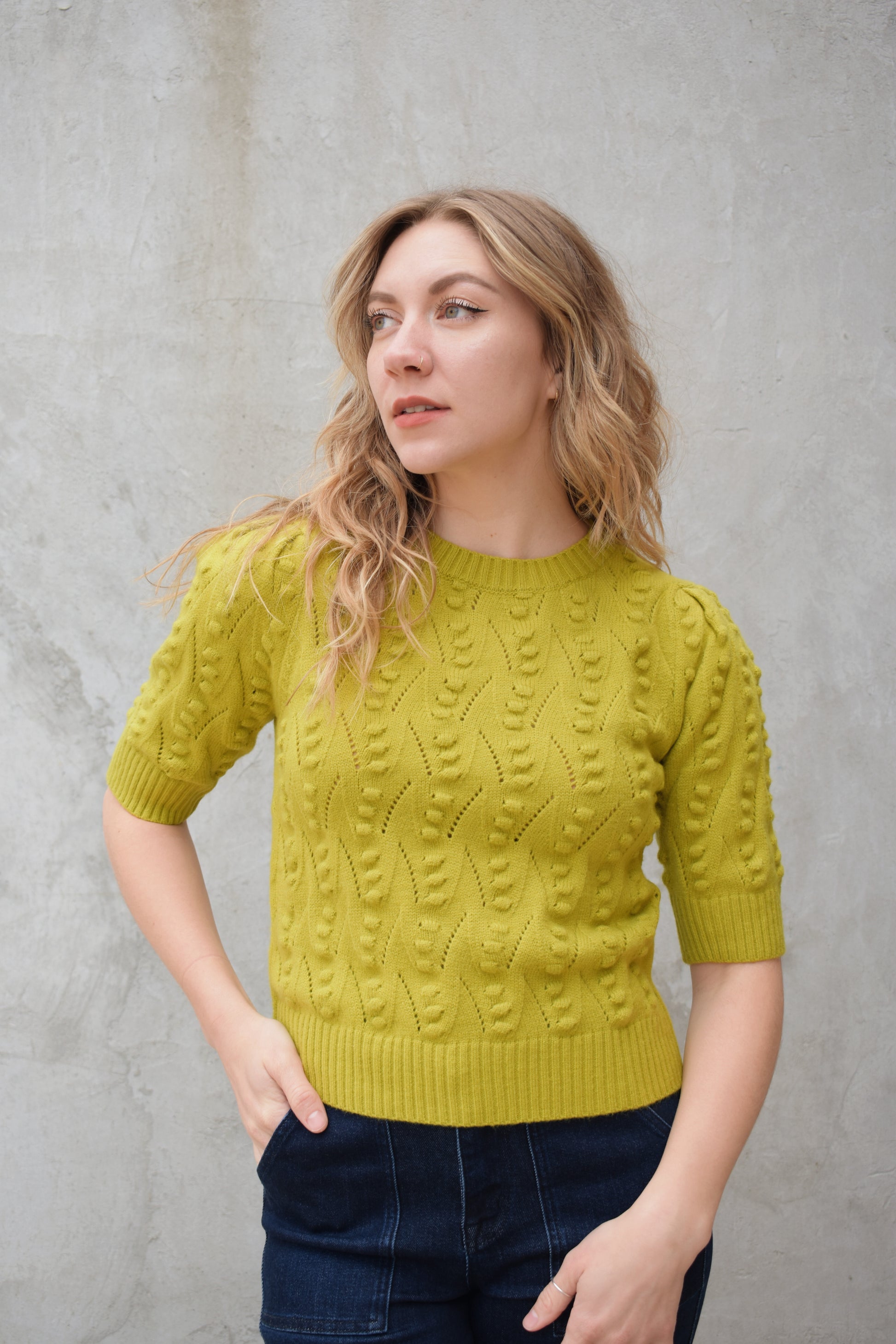 short sleeve crew neck sweater with  popcorn knit pointelle design and ribbed texture on cuffs hem and neckline chartreuse color straight fit