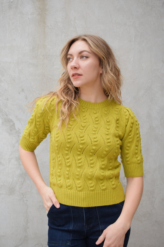 short sleeve crew neck sweater with  popcorn knit pointelle design and ribbed texture on cuffs hem and neckline chartreuse color straight fit