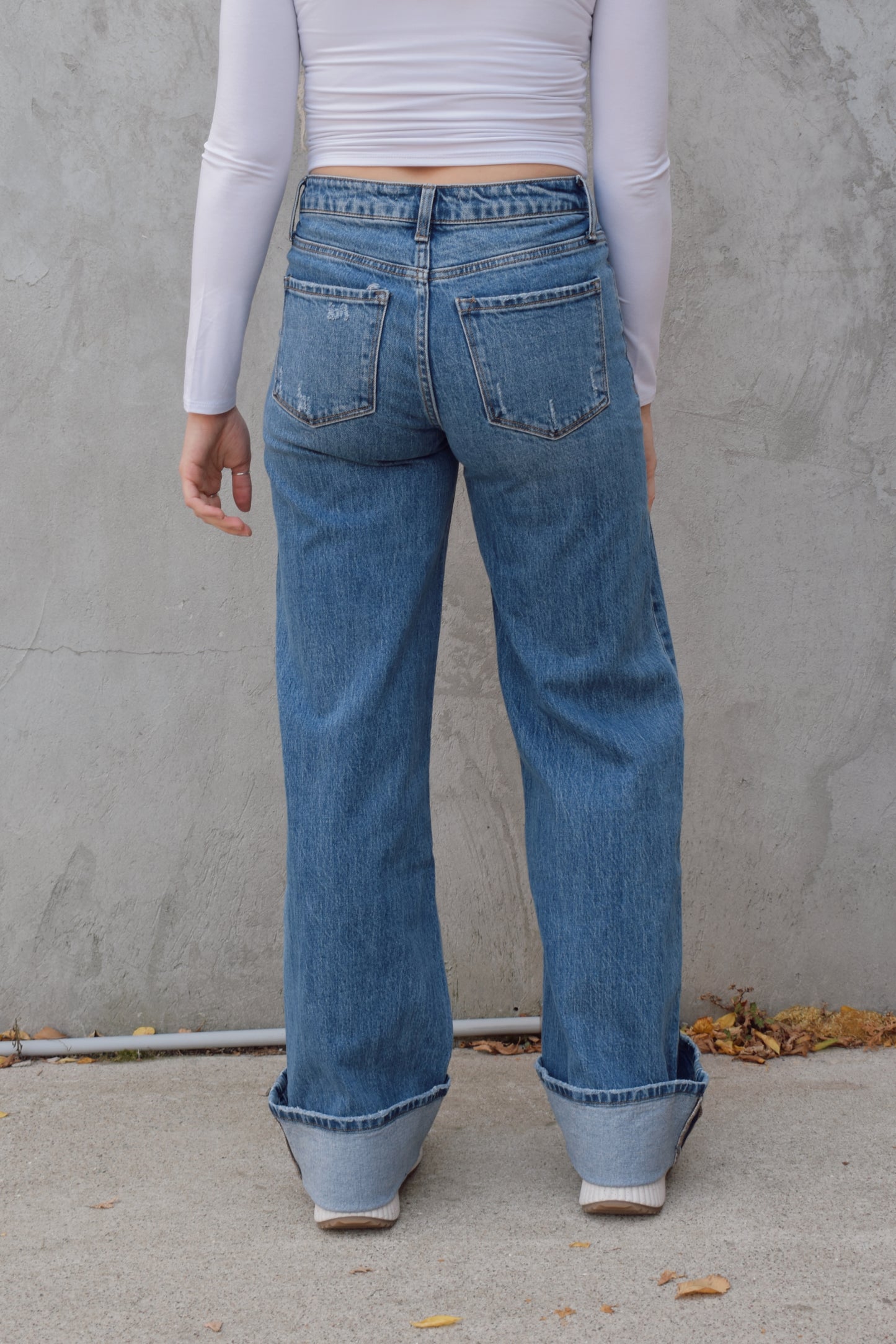 Long wide leg double panel double front pocket jeans with wide cuff at hem that is able to be uncuffed too. no distressing or holes, waistband is a little more rigid but denim is stretchy. zip and button enclosure, has beltloops 