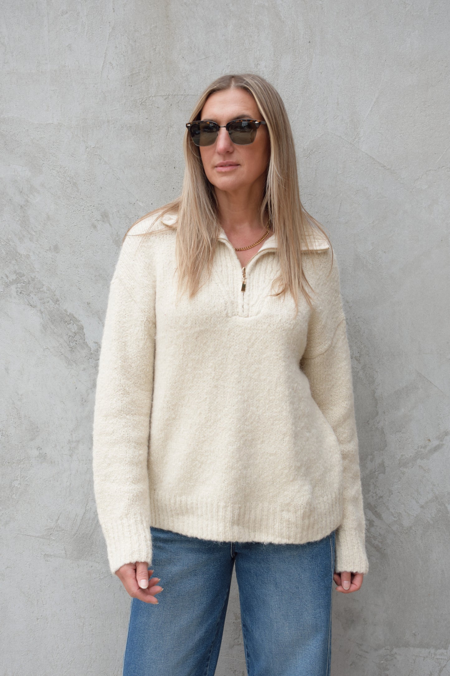 cozy knit blend quarter zip sweater with fold over collar, ribbed hem, full length and loose fit, drop shoulders