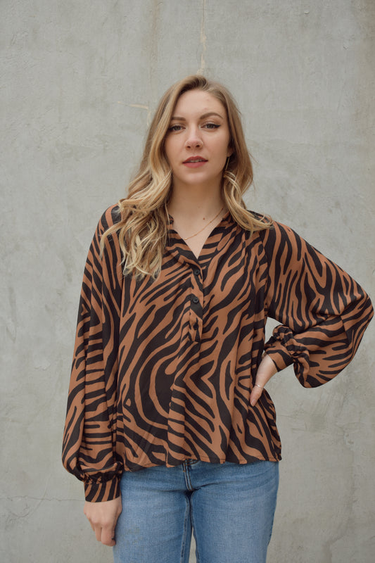 black and brown long sleeve animal print blouse with v neck and hidden buttons on front, full length flowy fit, balloon sleeves