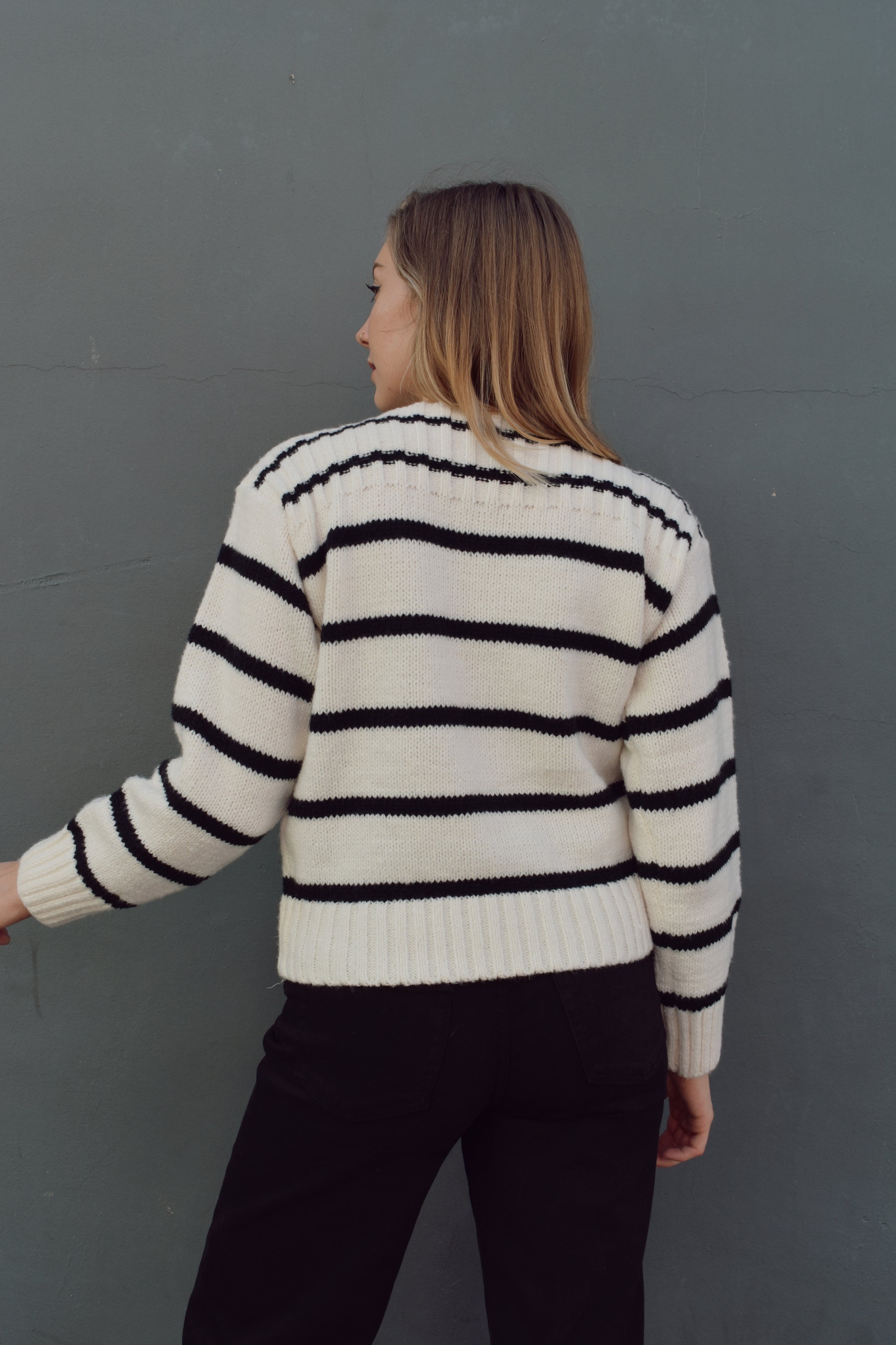 full length striped sweater with boat neck and ribbed detailing on neckline, hem and cuffs. horizontal stripes