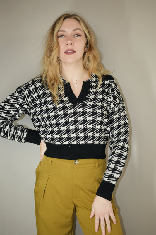 cropped collared houndstooth sweater with v neck and solid black outline on hem cuffs and neckline