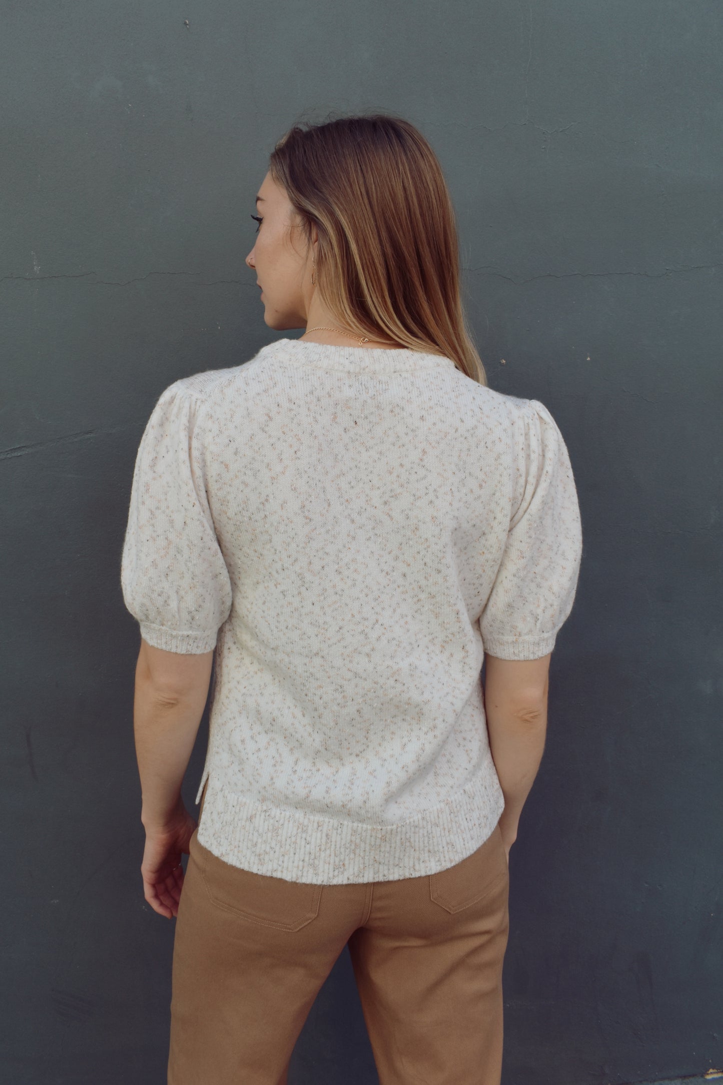 full length sweater with short balloon sleeves and crew neck,  fleck detailed with other colors of yarn, neutral colors.