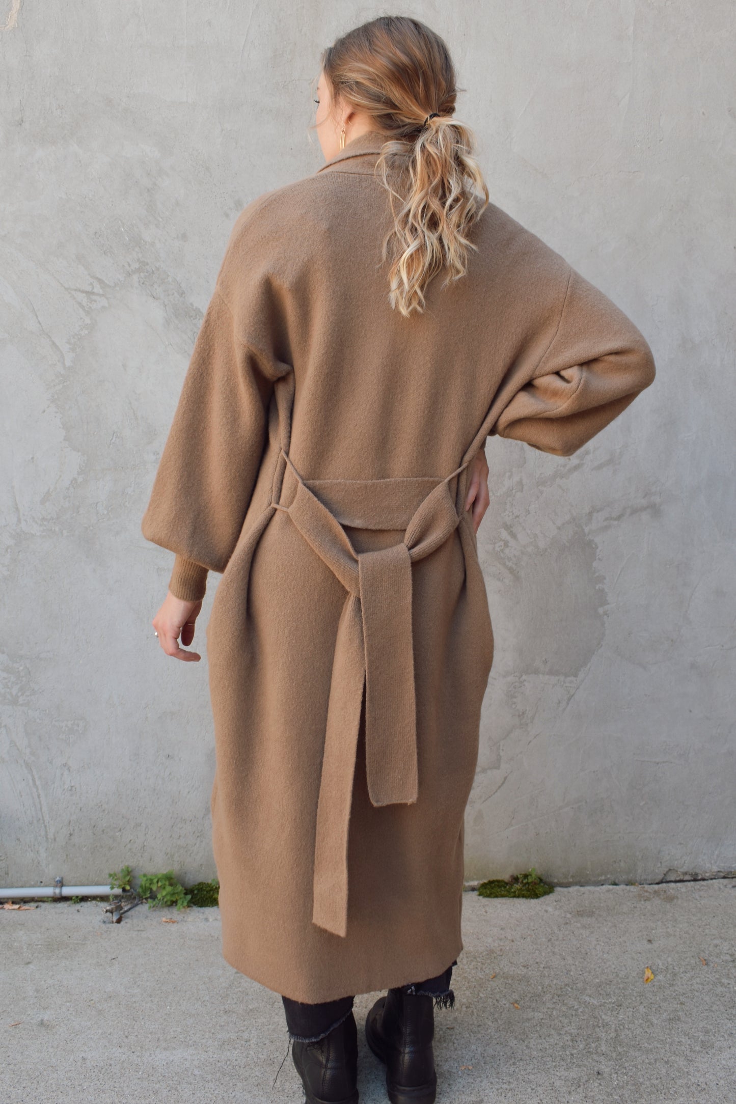 heavyweight cozy belted cardigan with fitted cuffs and pockets folds at collar hits at mid calf