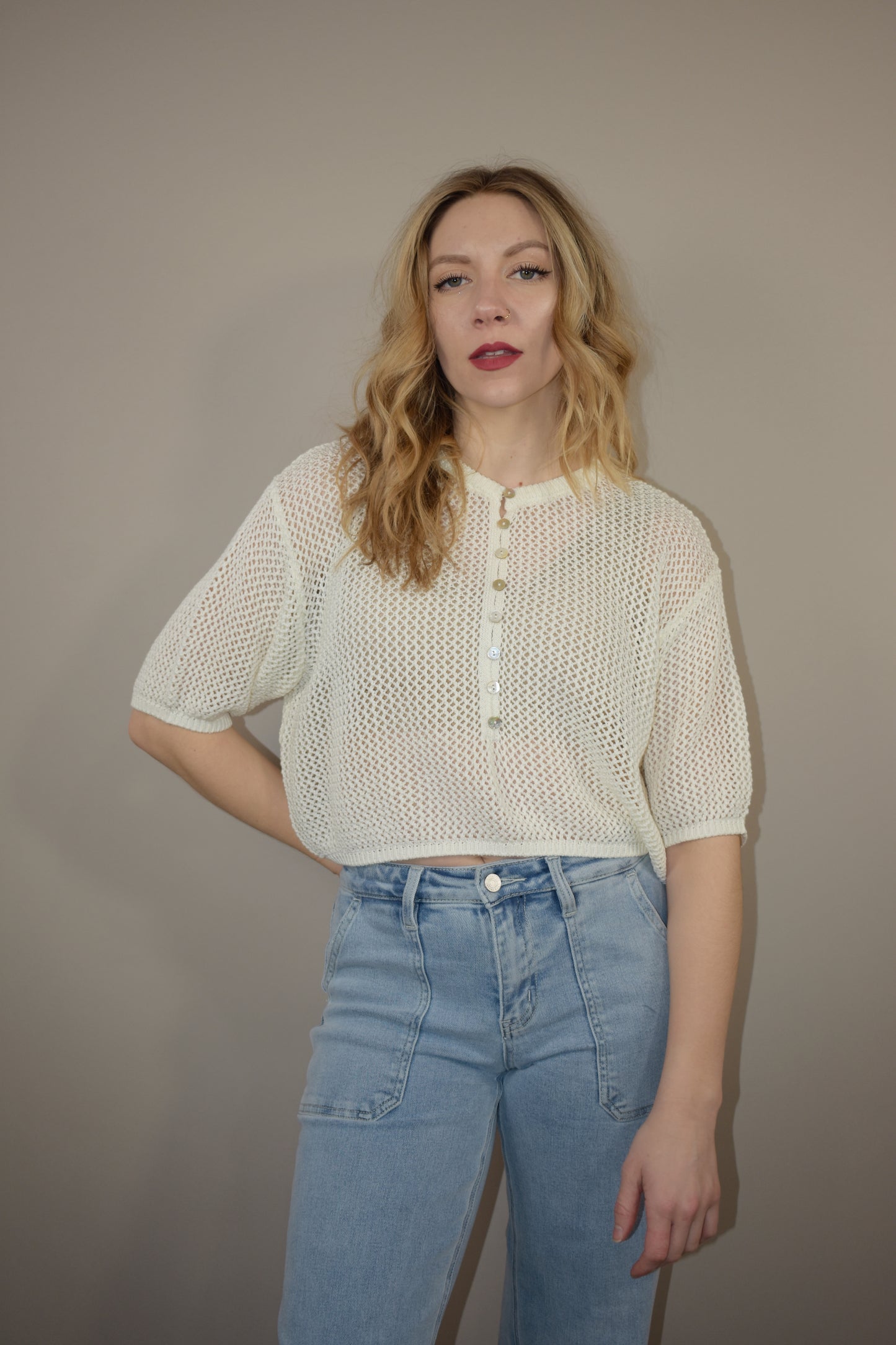 breezy cropped drop shoulder longer short sleeve crocheted shirt with buttons down the front and a crew neck style loose fitting perfect for warm weather