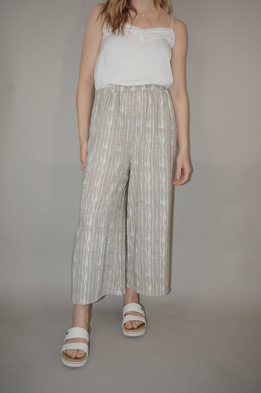 flowy cream and white printed pants slightly cropped, elastic waistband, has pockets, lightweight