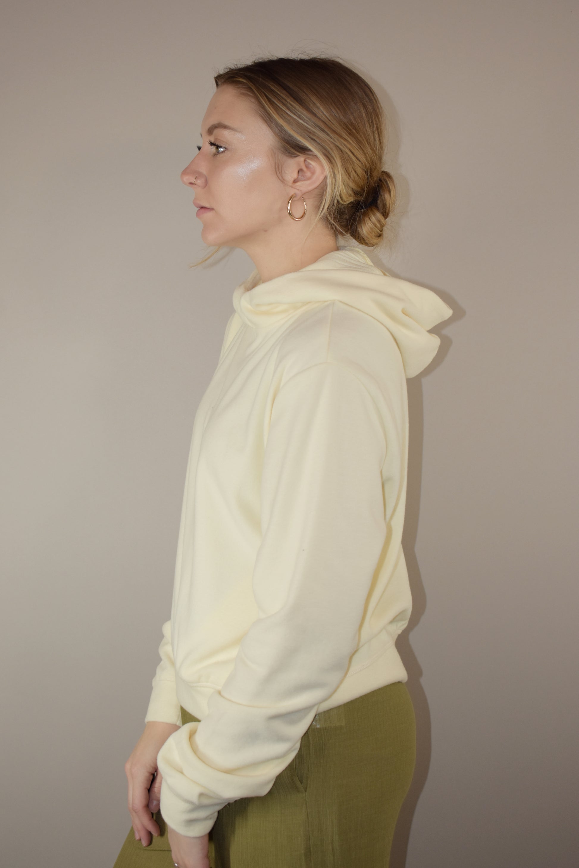 fleece hoodie with slight cowl neck and hood. has pockets that aren't connected. loose fitting full length