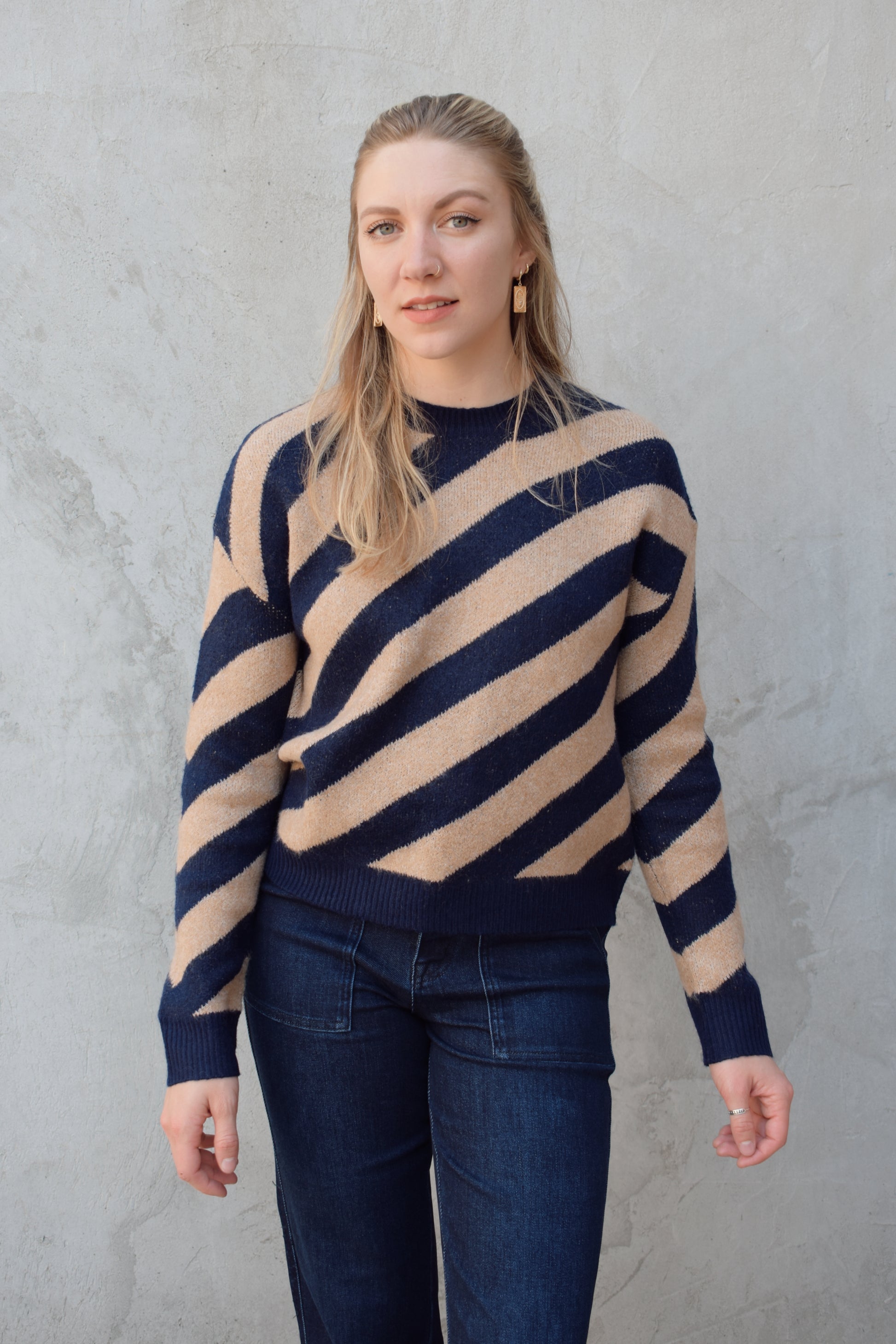 crew neck diagonal striped sweater with drop shoulder full length relaxed fit 