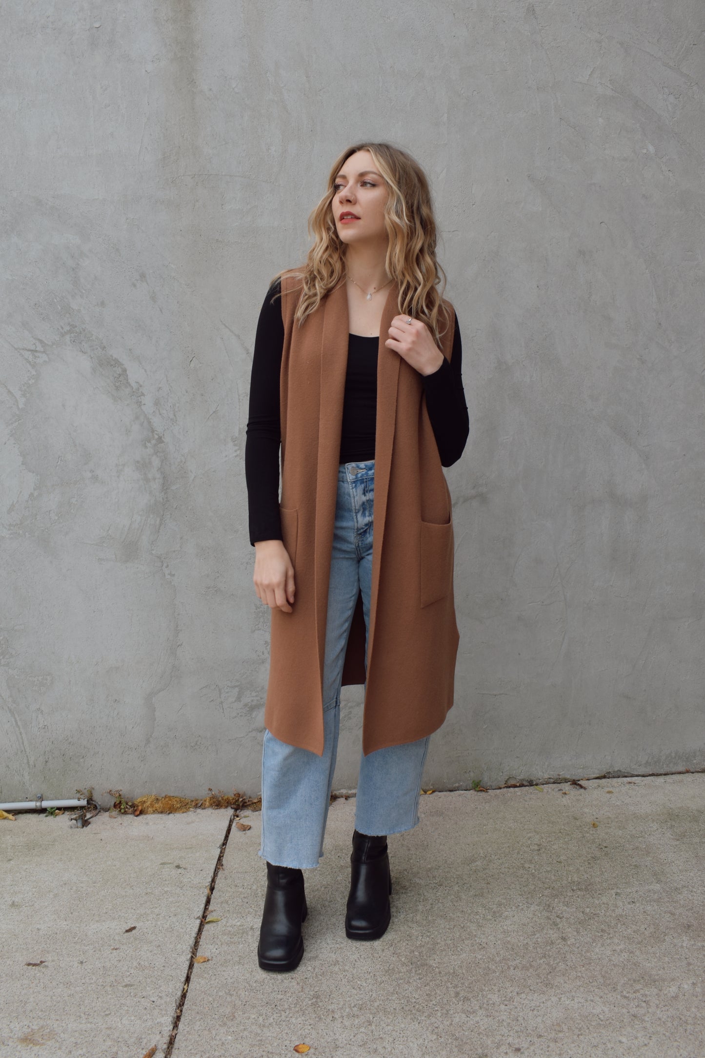 longline cardigan vest with shall collar and front patch pockets. side slits