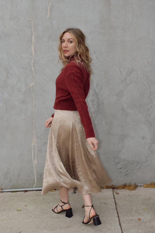 textured gold midi skirt with pleated details, a line flare, zip back enclosure, fitted waist