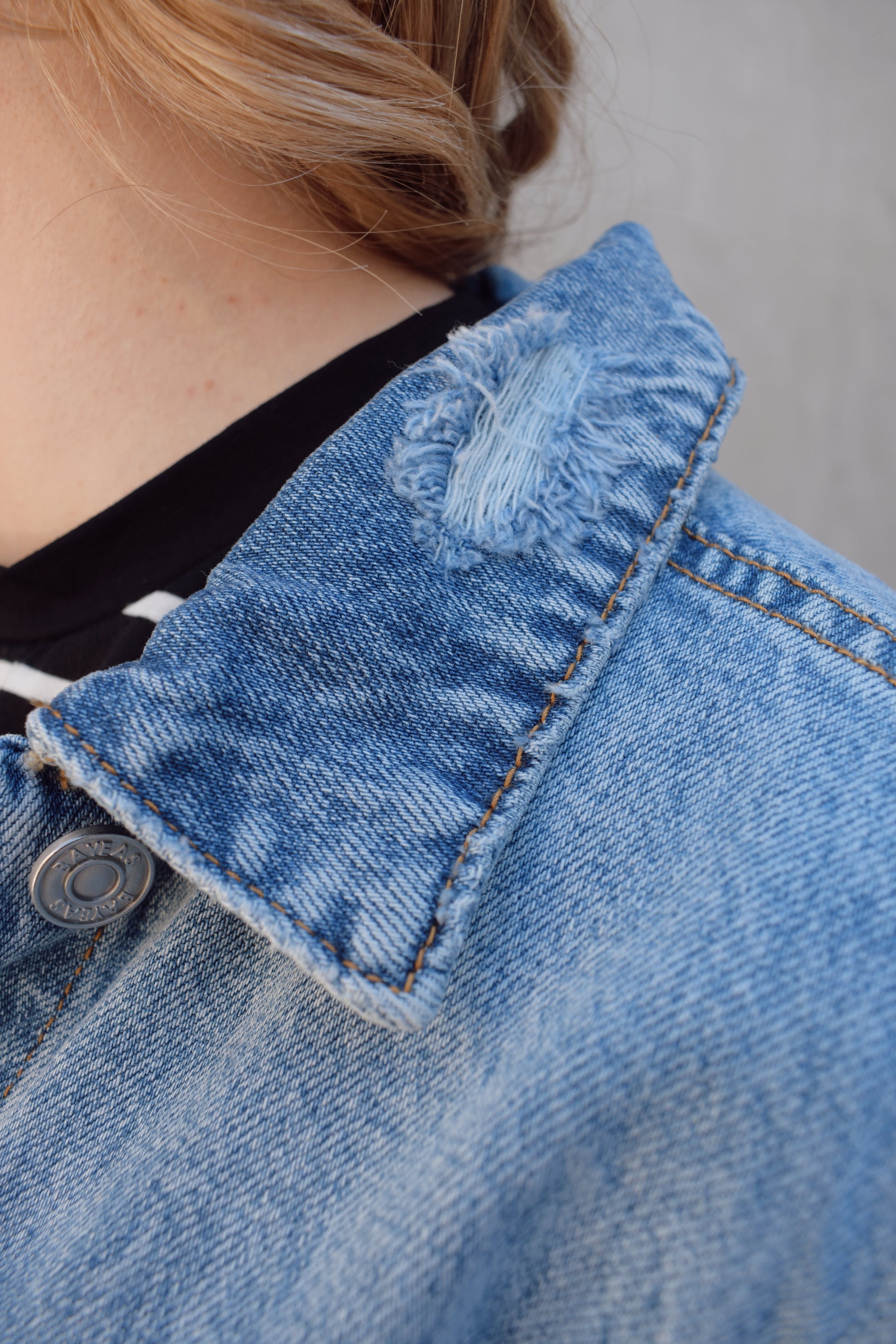 medium wash distressed jean jacket staple for wardrobe relaxed fit full length