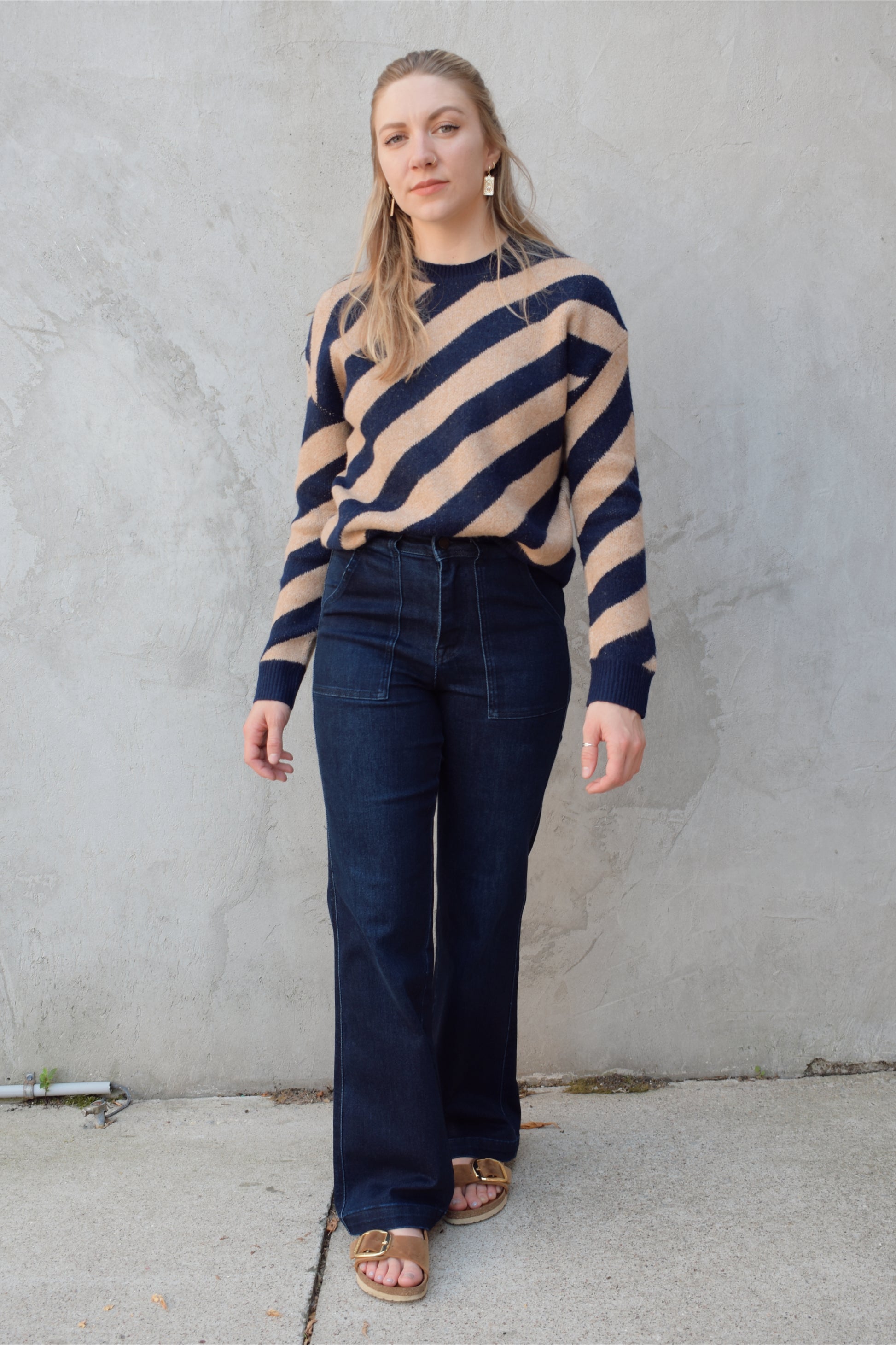 crew neck diagonal striped sweater with drop shoulder full length relaxed fit 