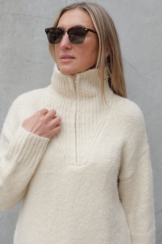 cozy knit blend quarter zip sweater with fold over collar, ribbed hem, full length and loose fit, drop shoulders