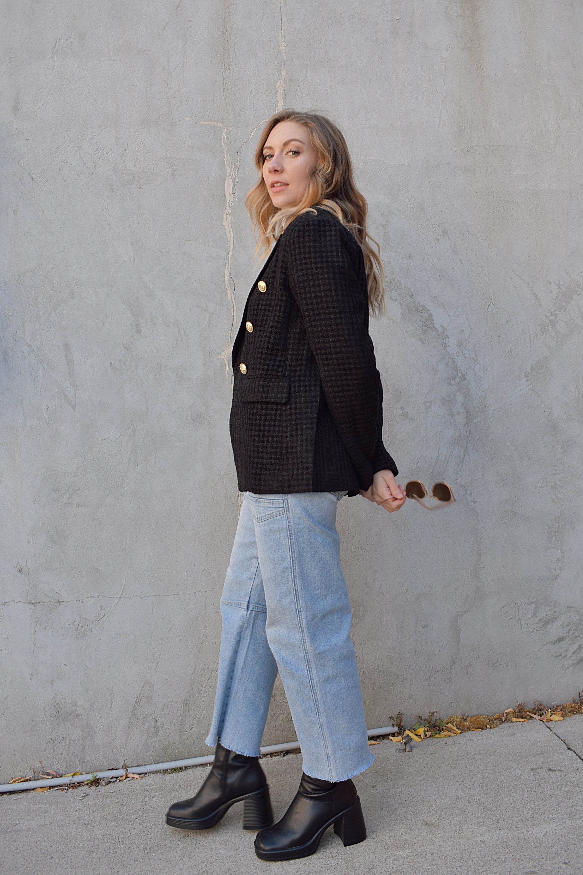 black tweed blazer with flap enclosure front pockets, gold sailor buttons, double breasted, notched front hem, slim fit, full length