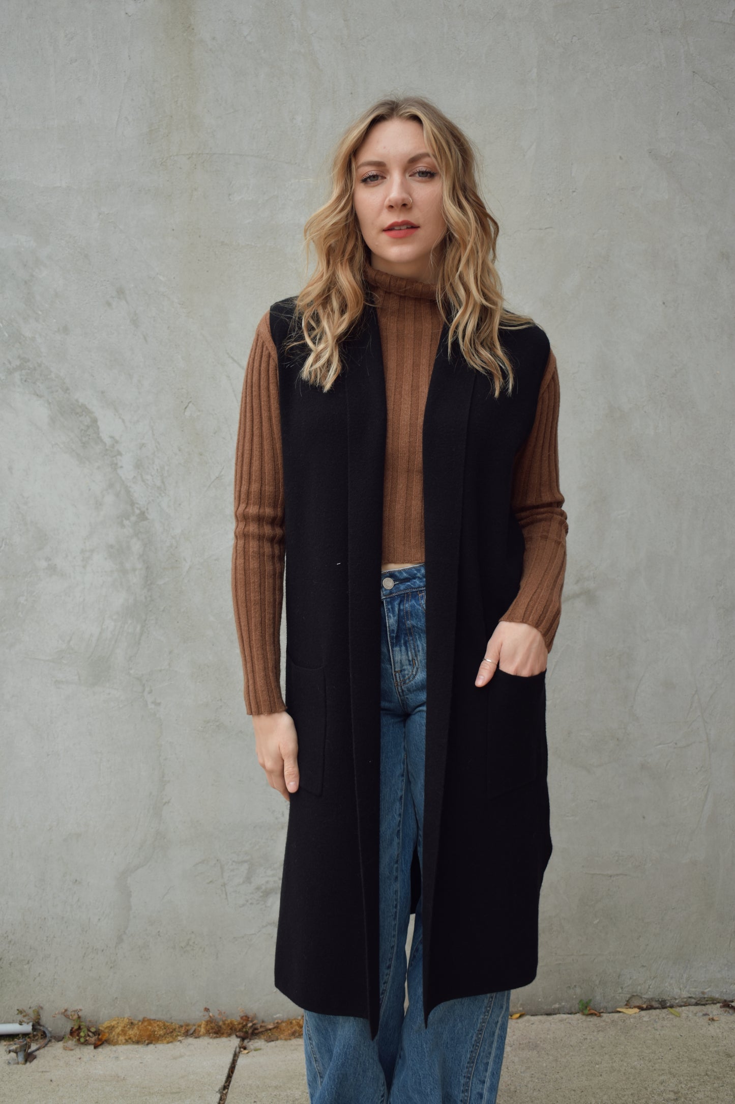 longline cardigan vest with shall collar and front patch pockets. side slits