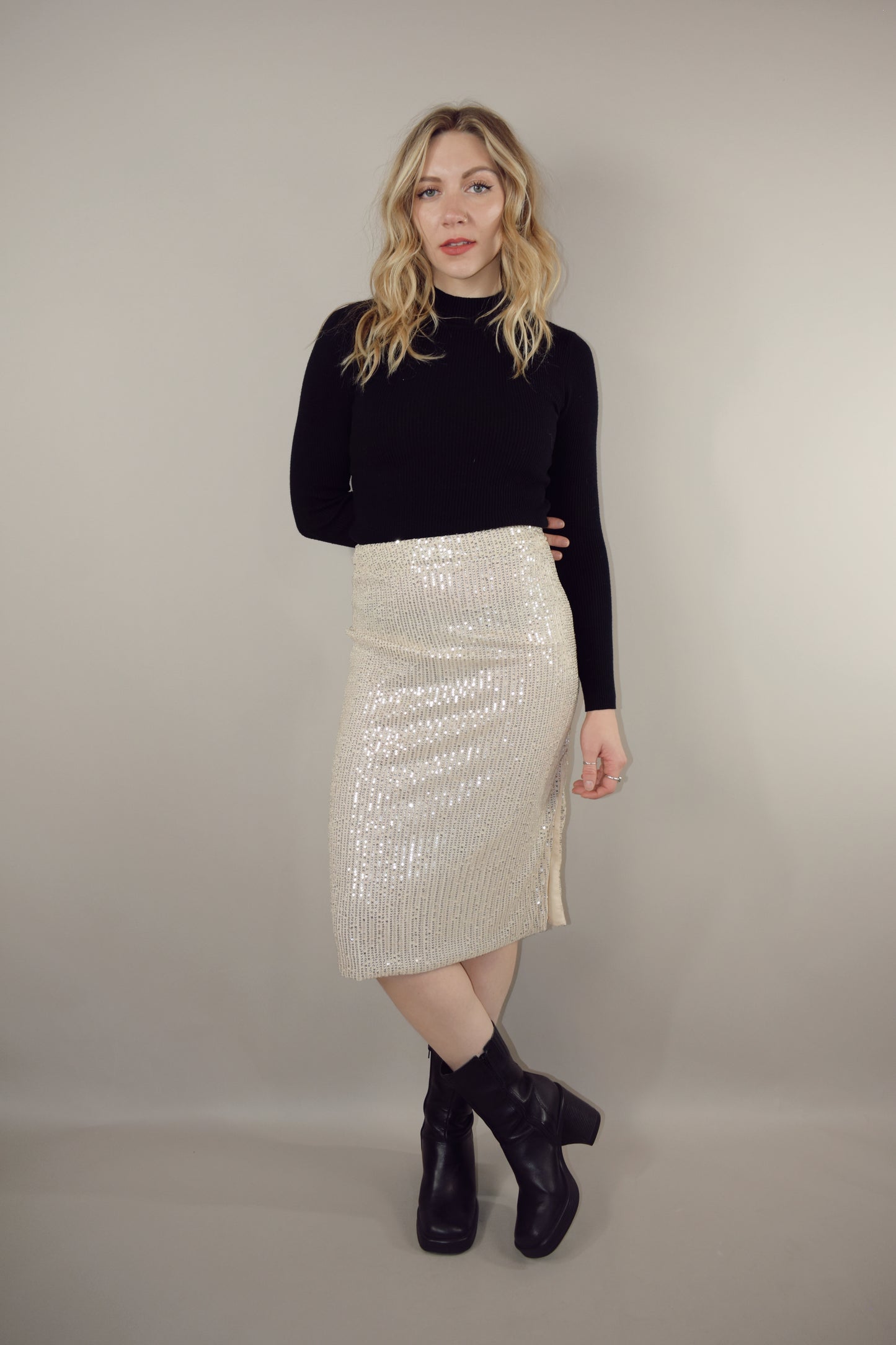 ivory sequin midi pencil skirt with side slit and side zip enclosure hits just below the knee