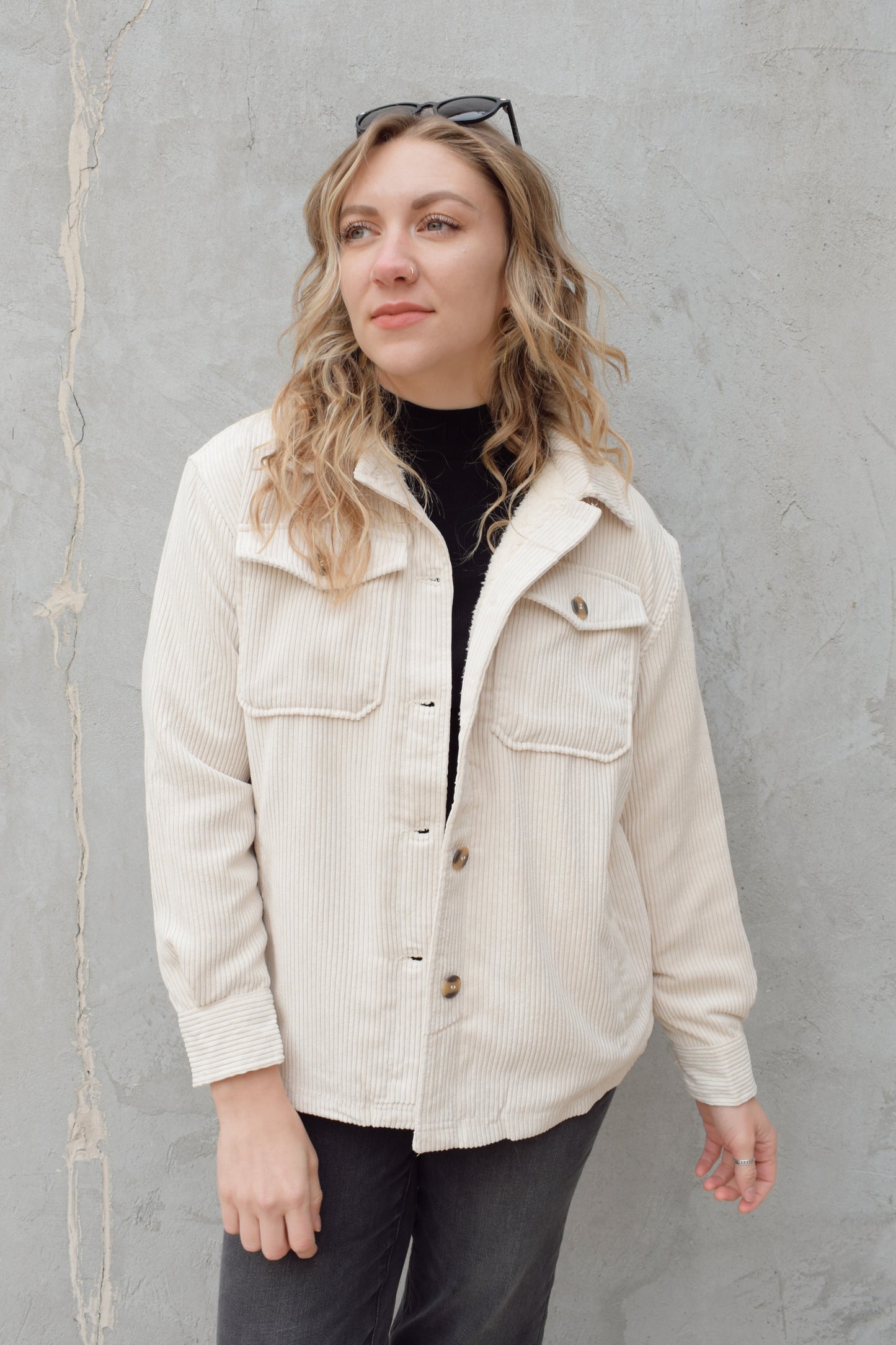 corduroy button down shacket, fur lined, has side pockets, patch breast pockets with fold and button enclosure, full length