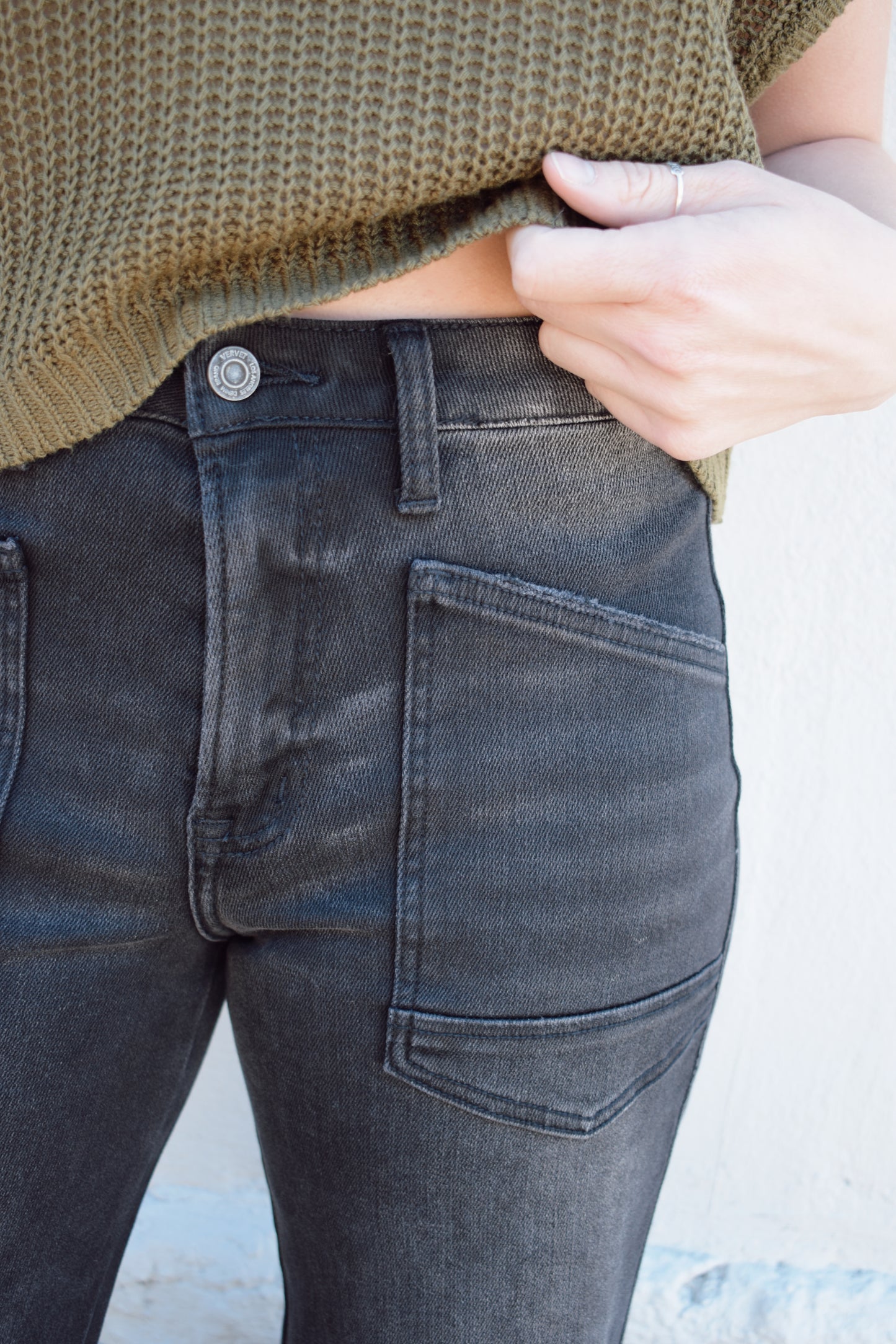 black washed cropped slight barrel jeans stretch denim slanted patch pockets, raw hem, seam detail at knee, high rise, no holes