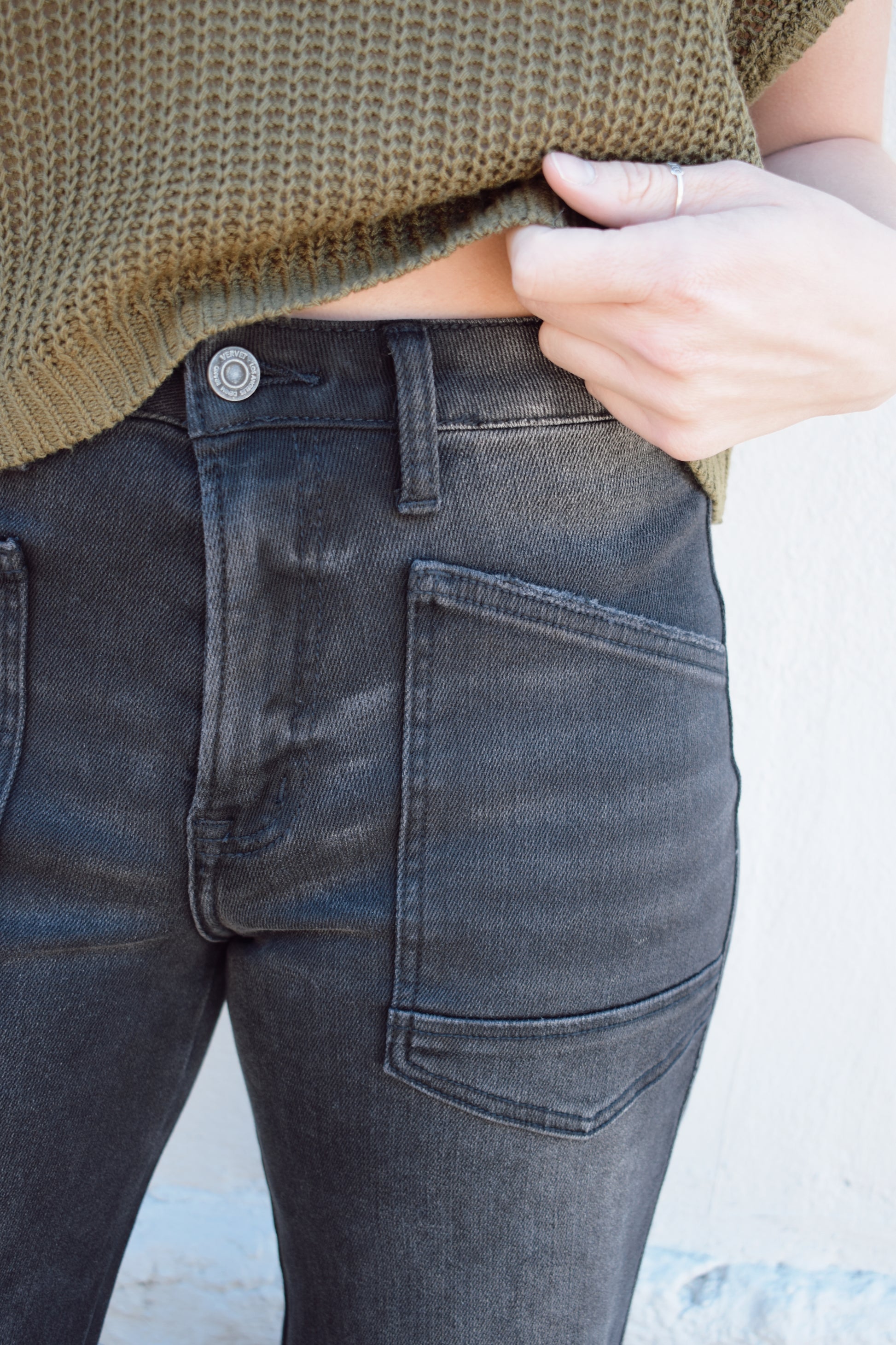 black washed cropped slight barrel jeans stretch denim slanted patch pockets, raw hem, seam detail at knee, high rise, no holes